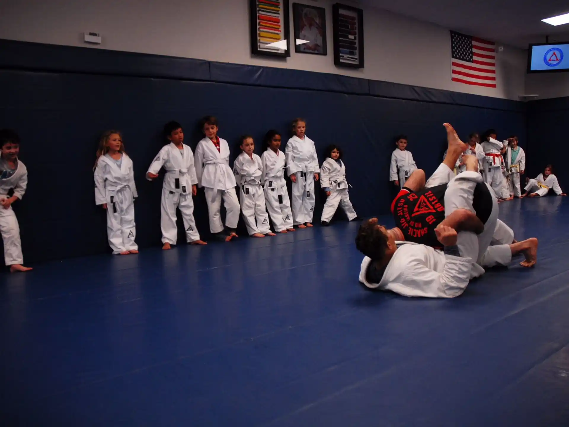 a group of people in karate uniforms
