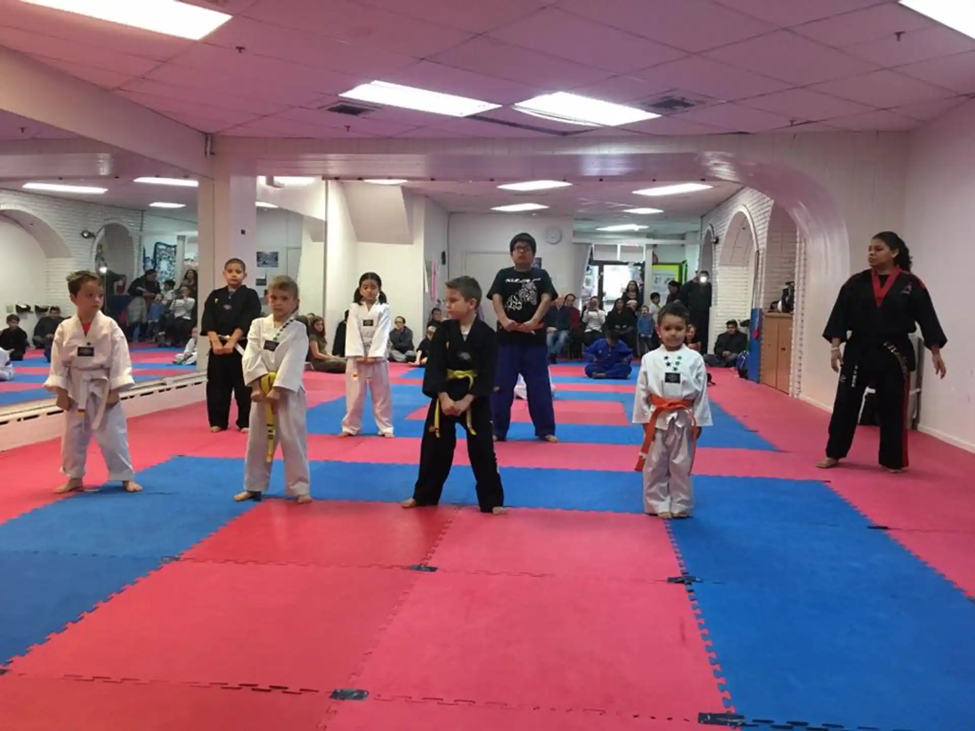 a group of people in karate uniforms