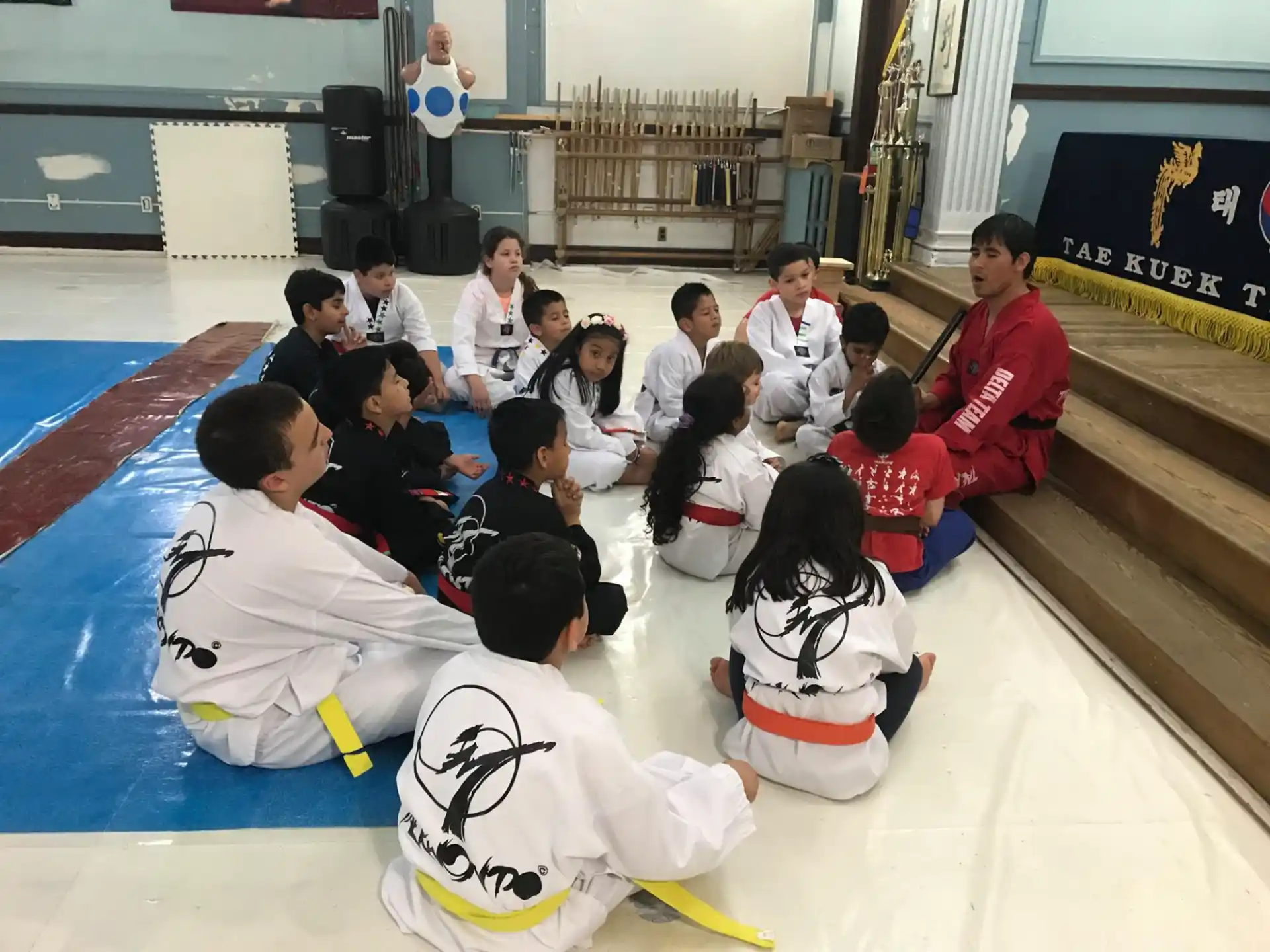 a group of people sitting on the floor