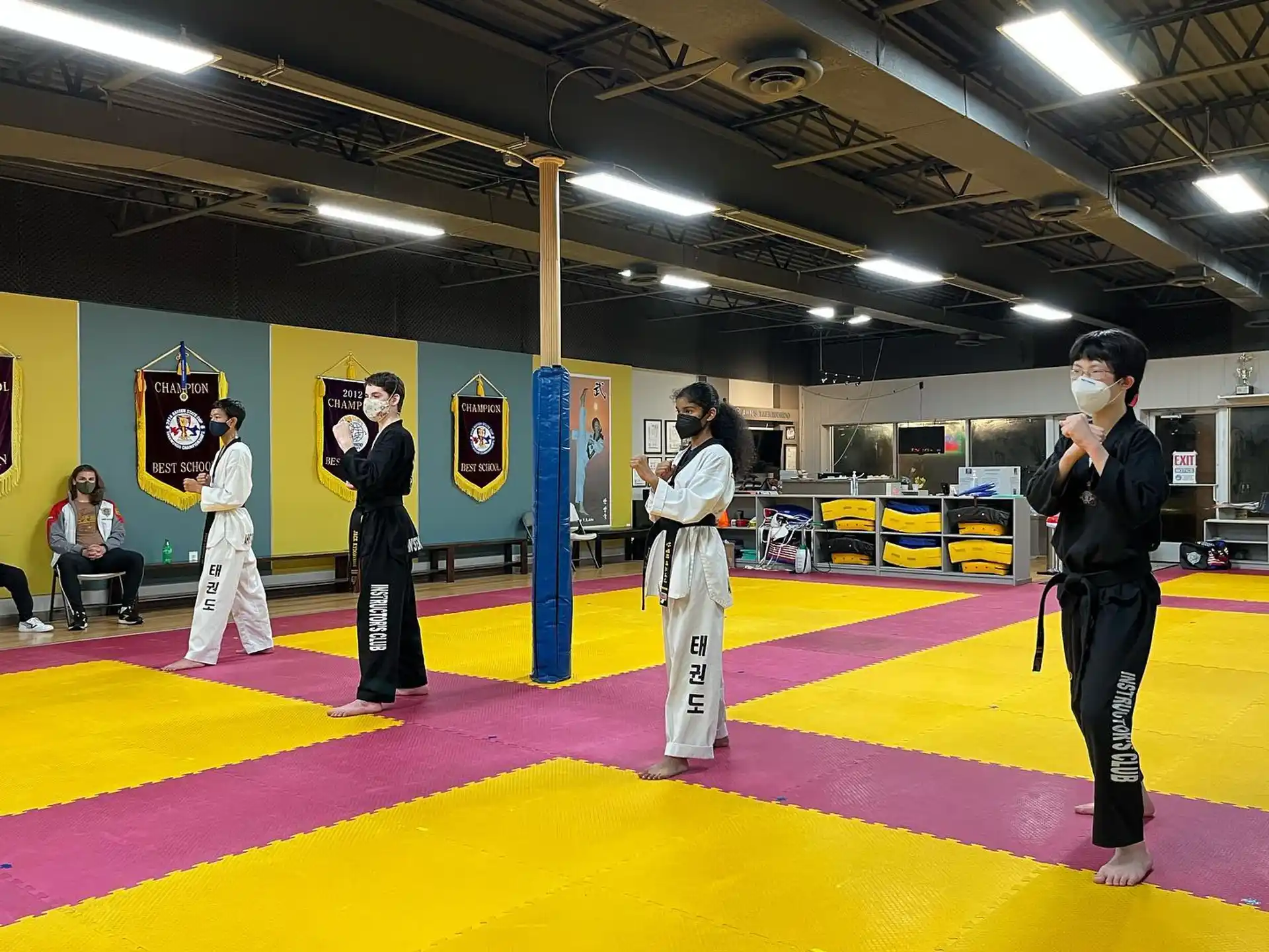 a group of people in a karate class