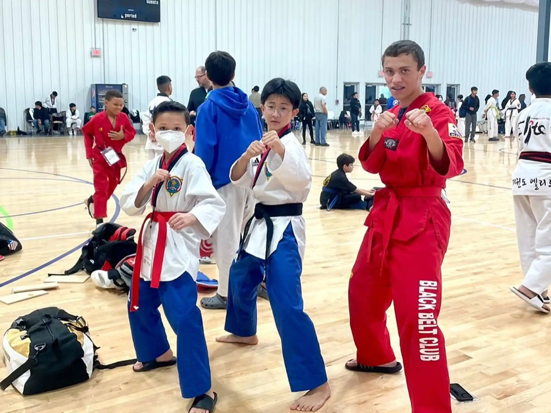 a group of people in karate uniforms