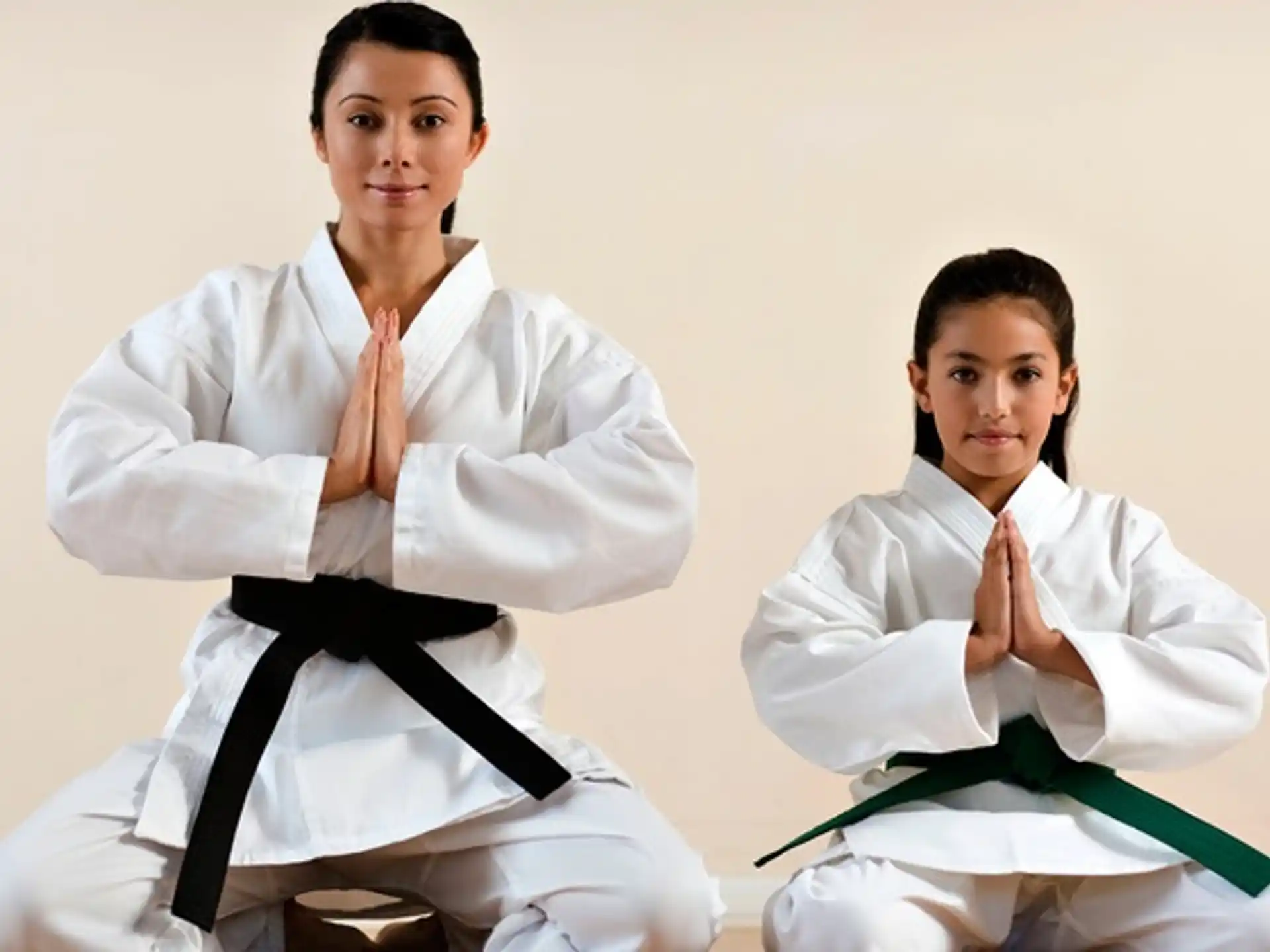 a couple of people in karate uniforms