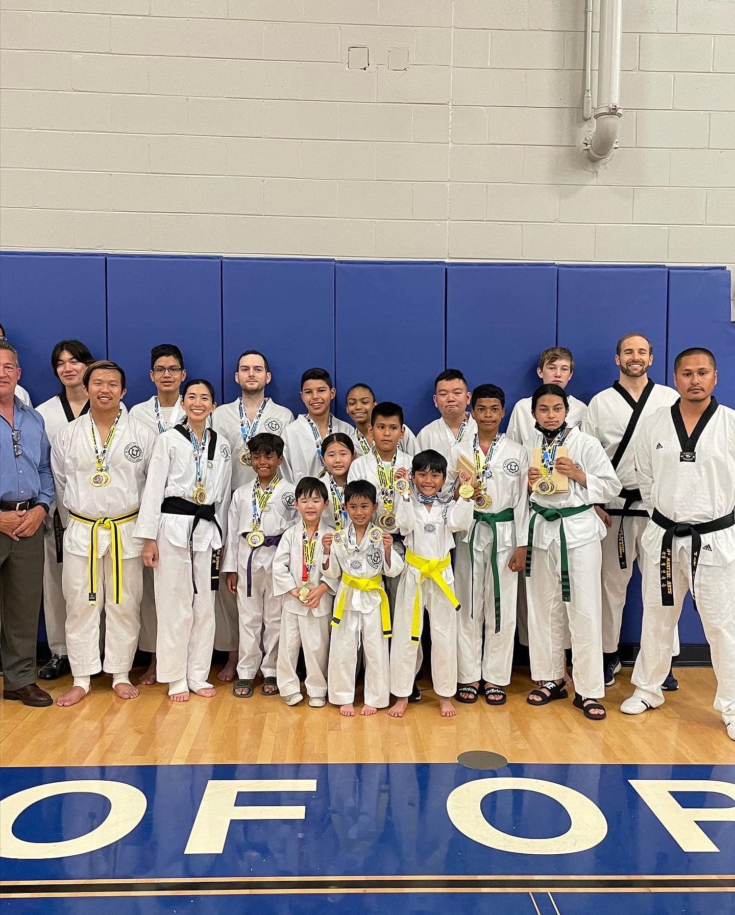 a group of people in karate uniforms