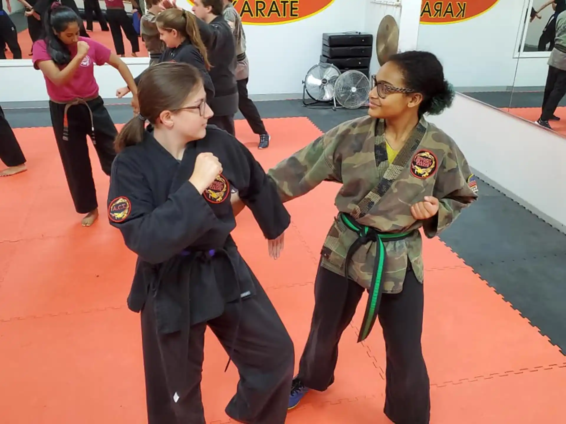 a person in a uniform with another woman in a uniform