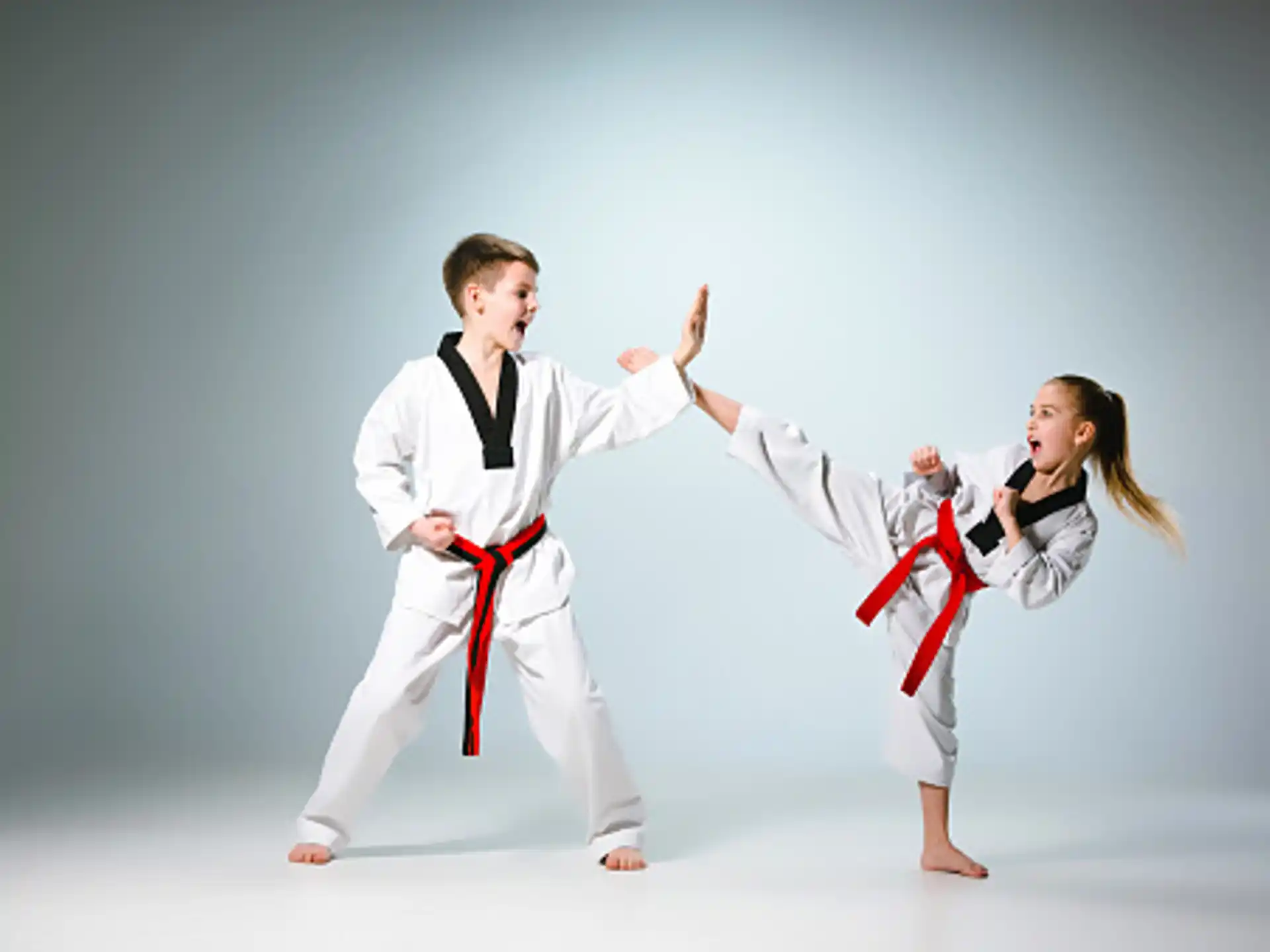 a man and a woman in karate uniforms