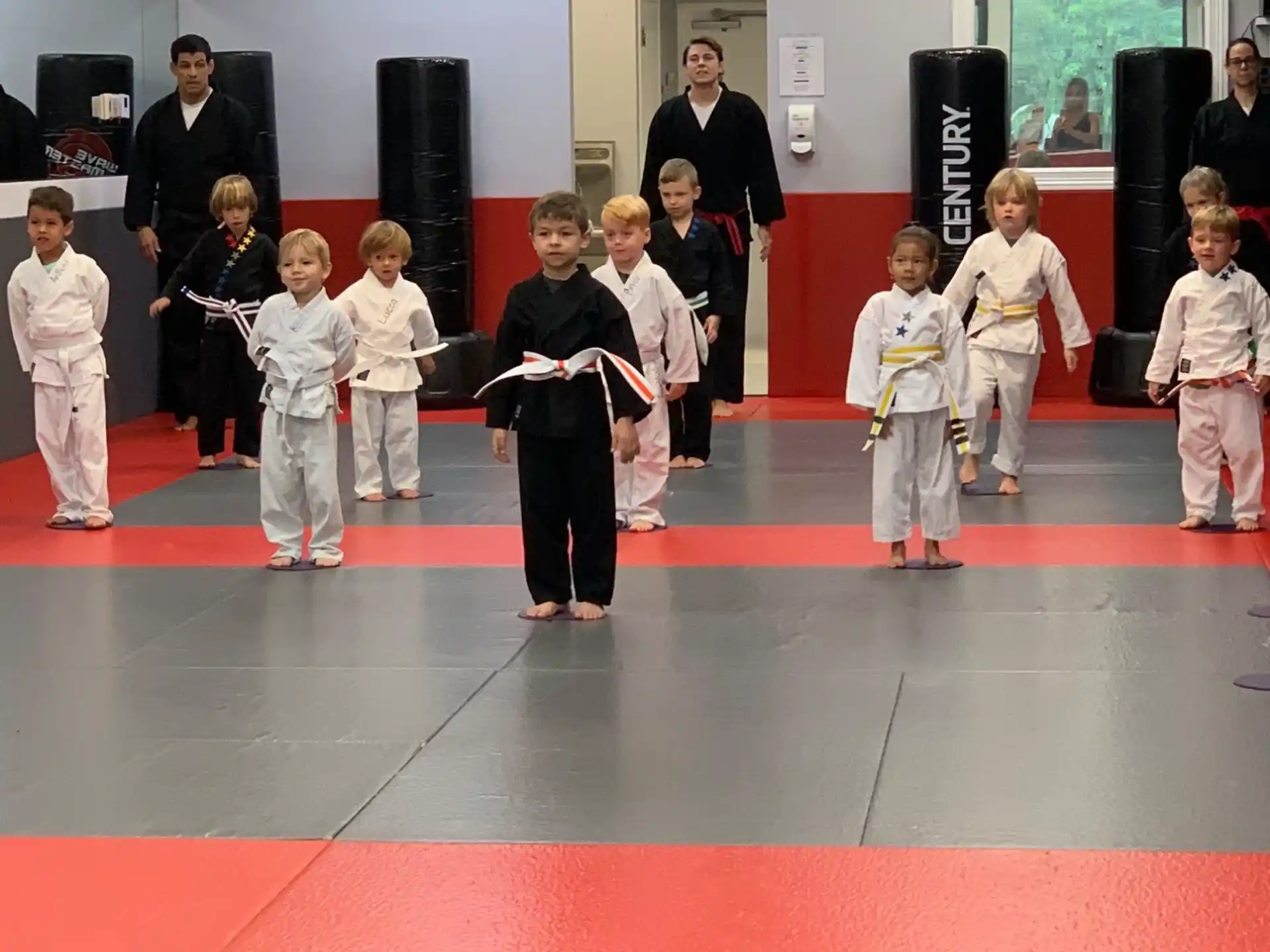a group of children in karate uniforms