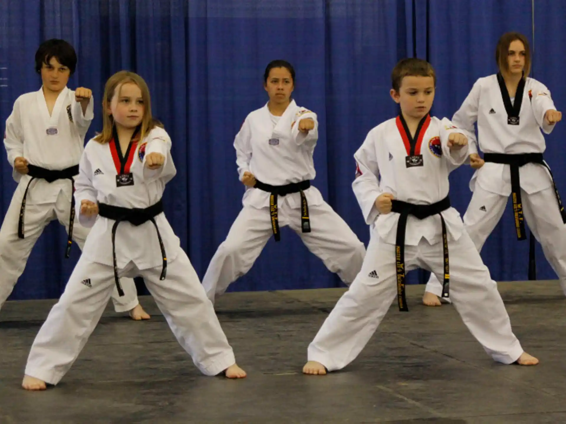 a group of people in karate uniforms