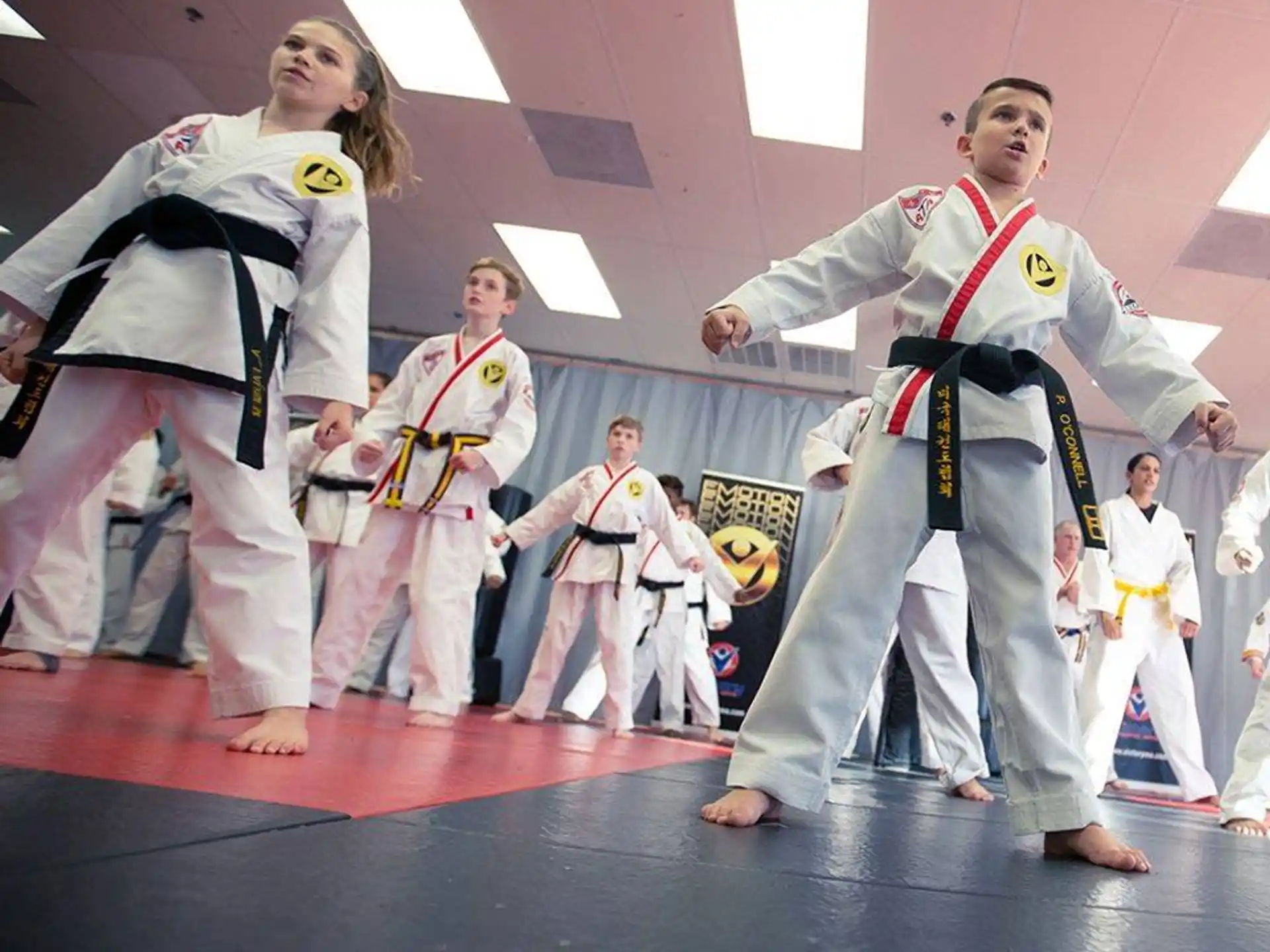 a group of people in karate uniforms
