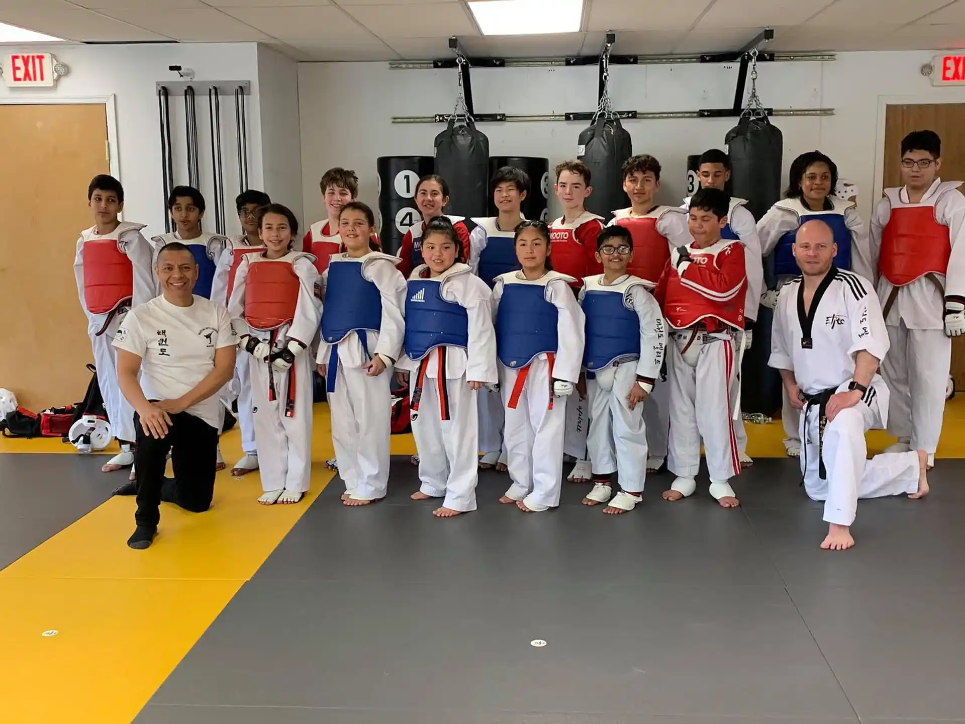 a group of people in karate uniforms