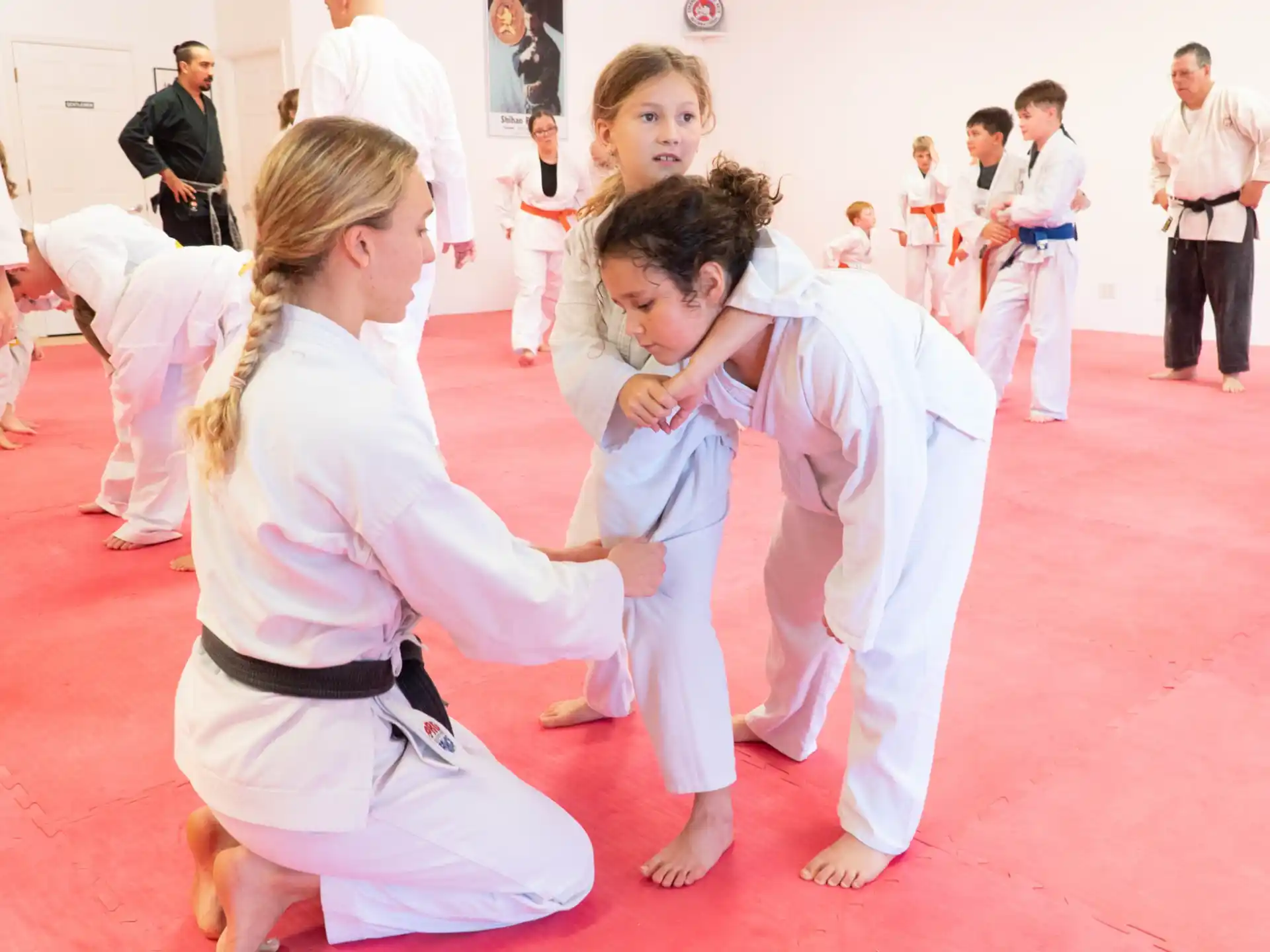 a group of people in karate uniforms