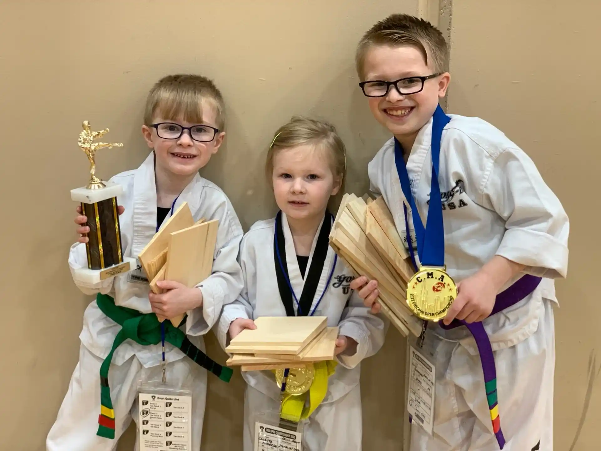 a group of people holding trophies