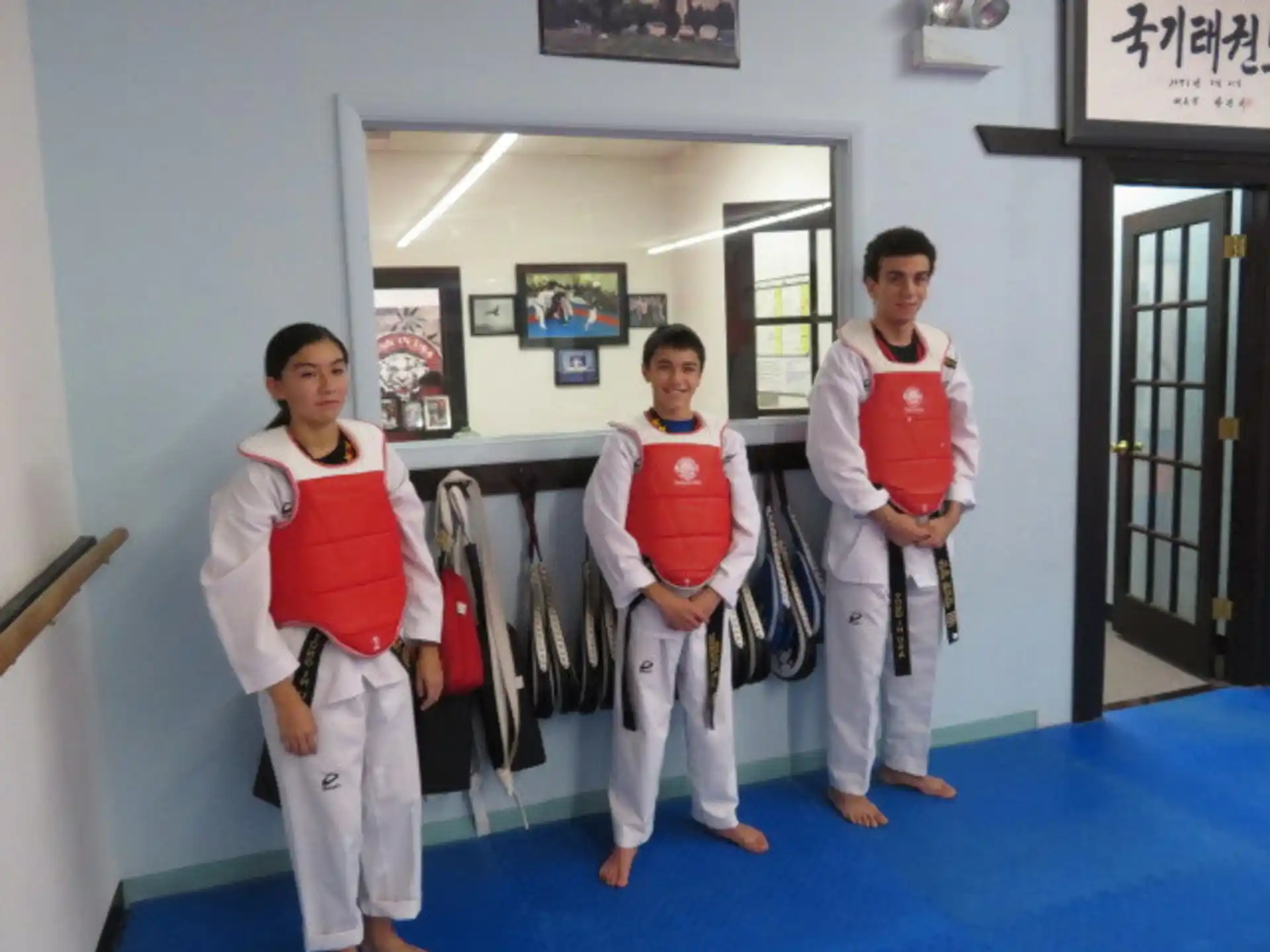 a group of people in karate uniforms