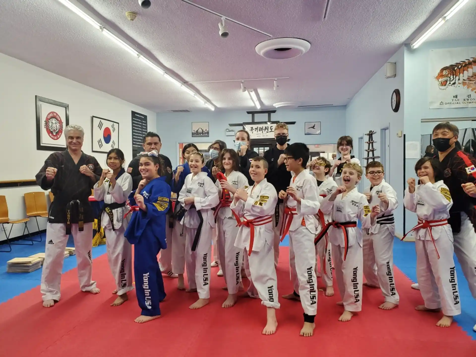 a group of people in karate uniforms