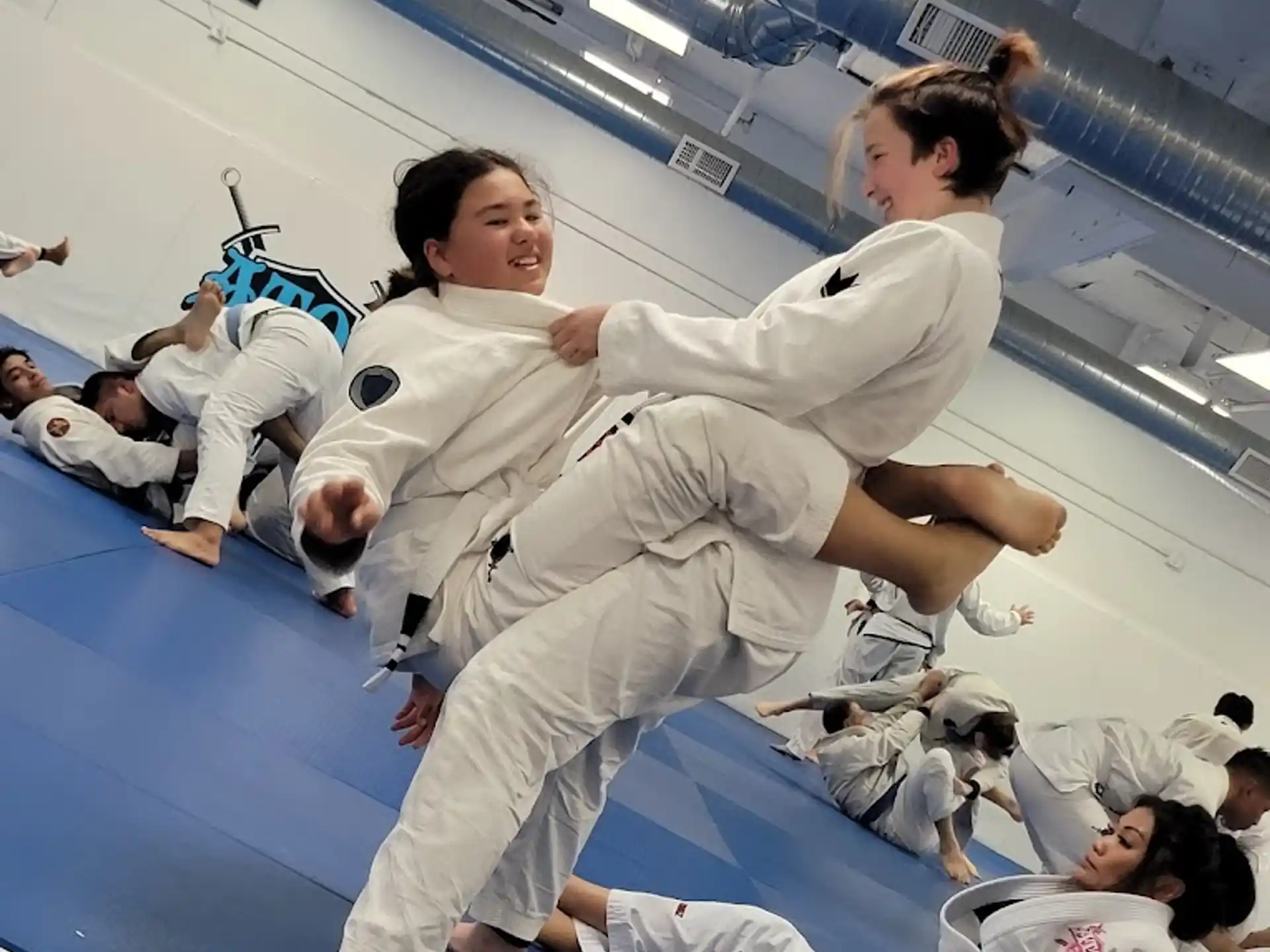 a group of people in karate uniforms