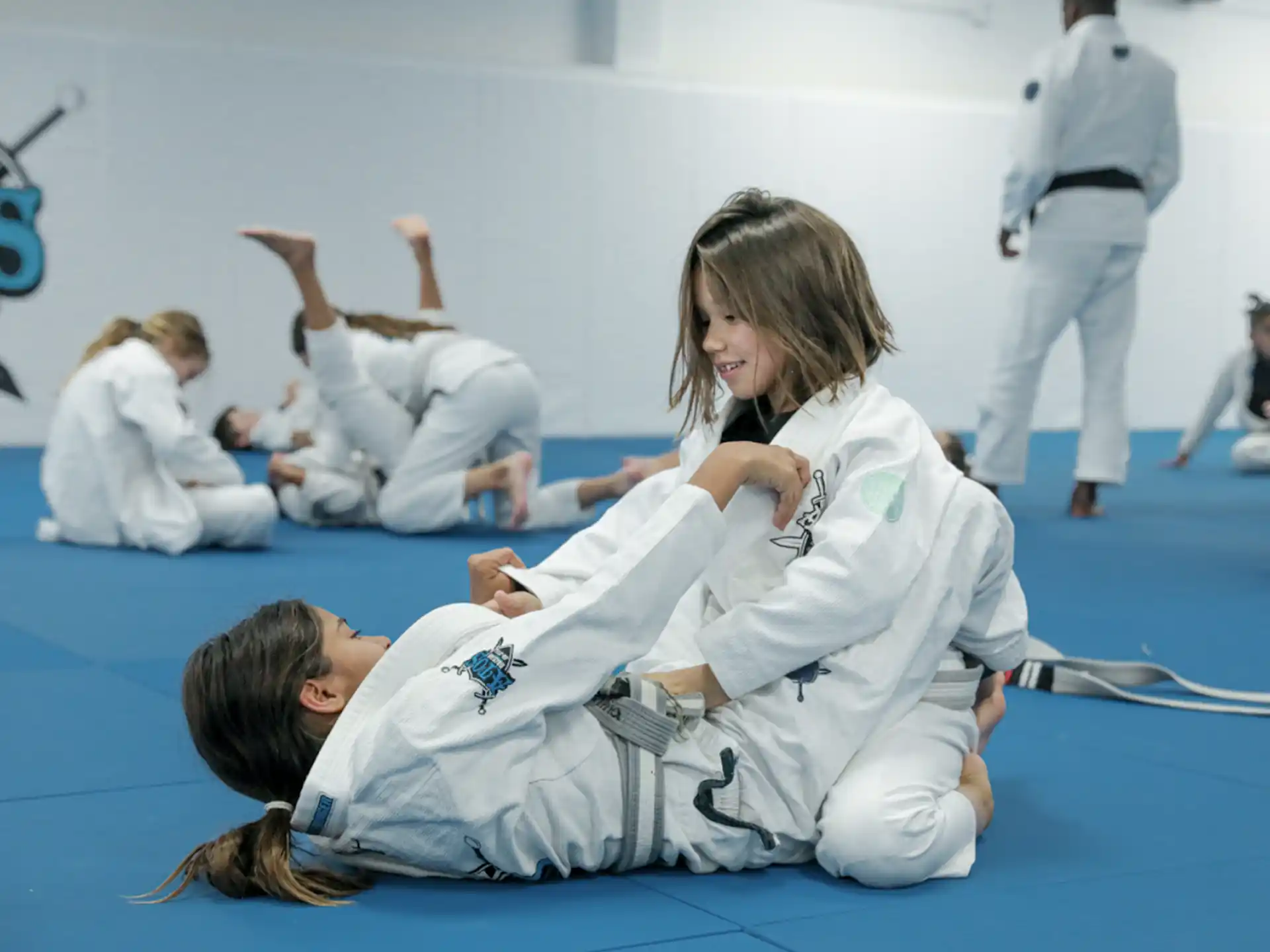 a group of people in karate uniforms