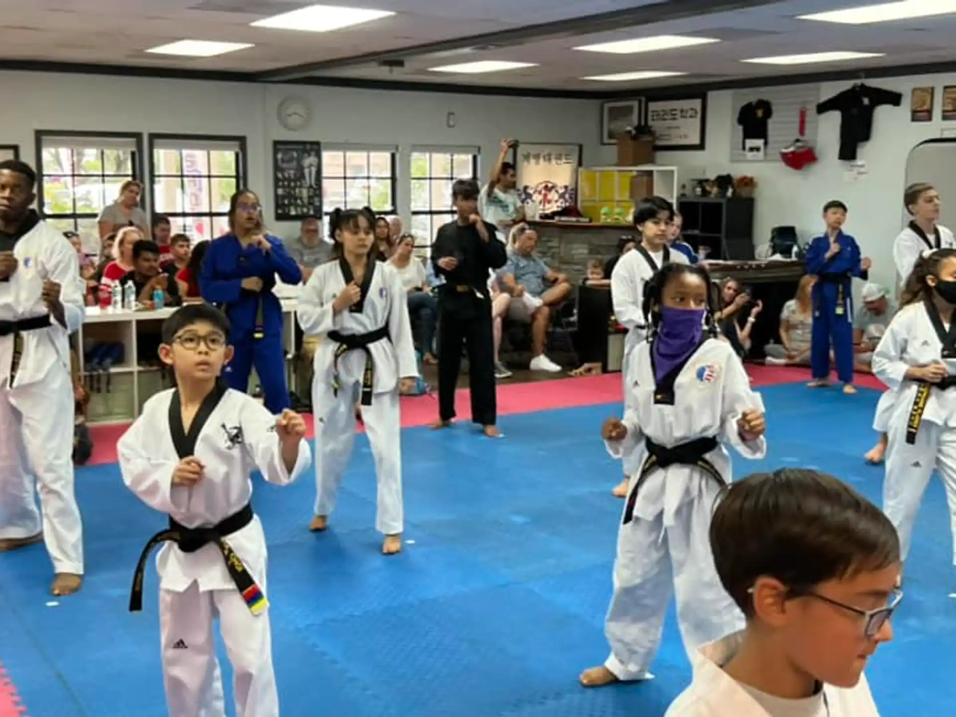 a group of people in karate uniforms
