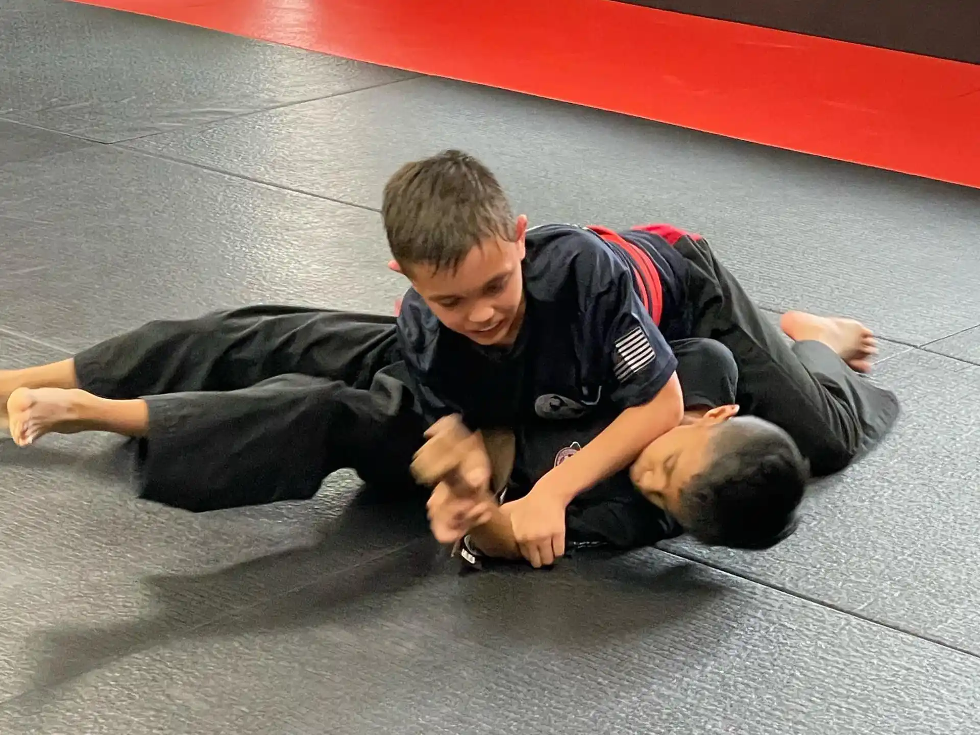 two boys lying on the floor