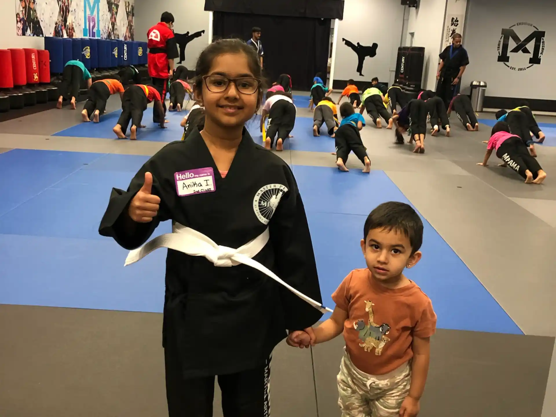 a person and a boy holding a large black object