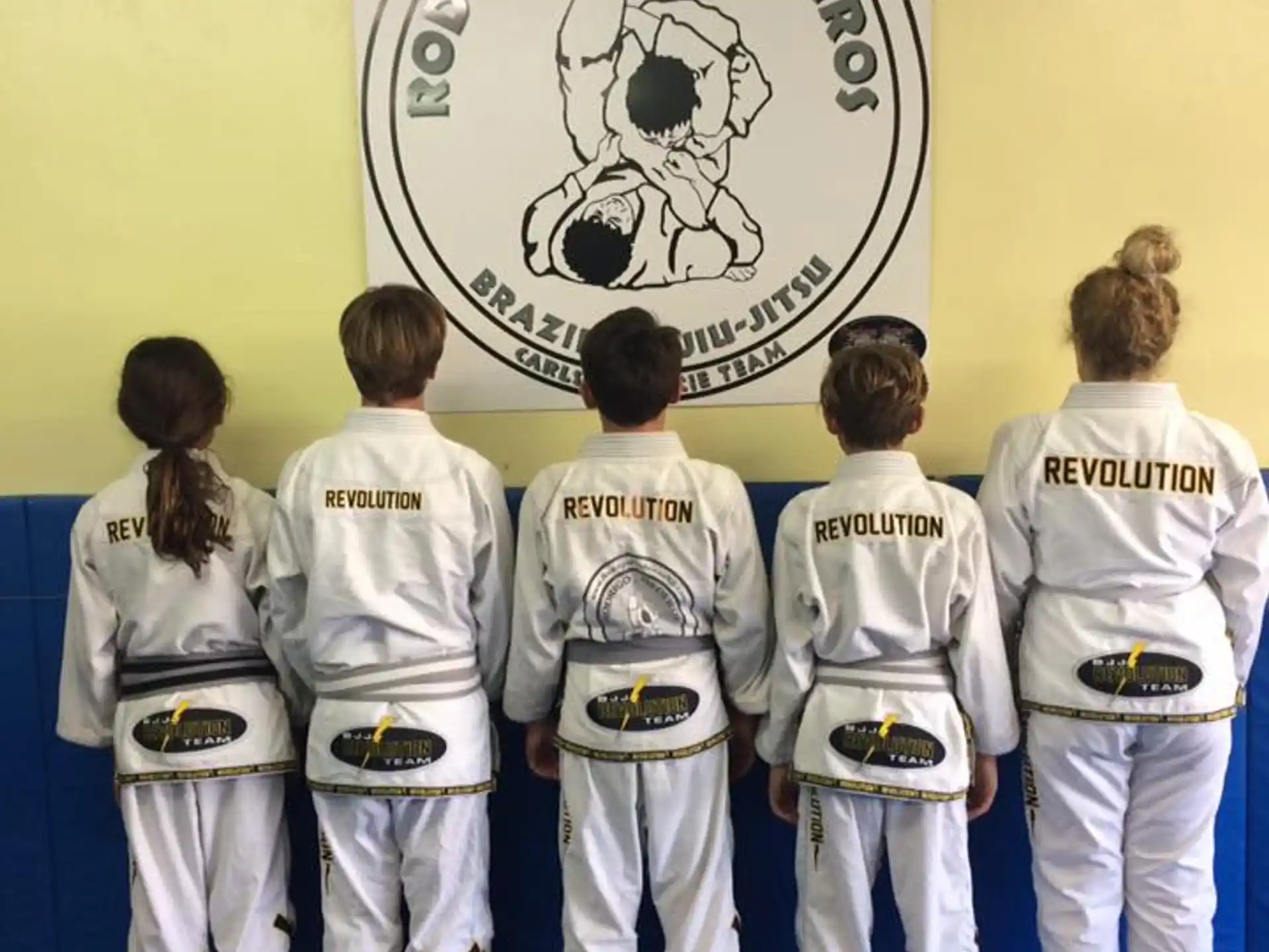 a group of people in karate uniforms
