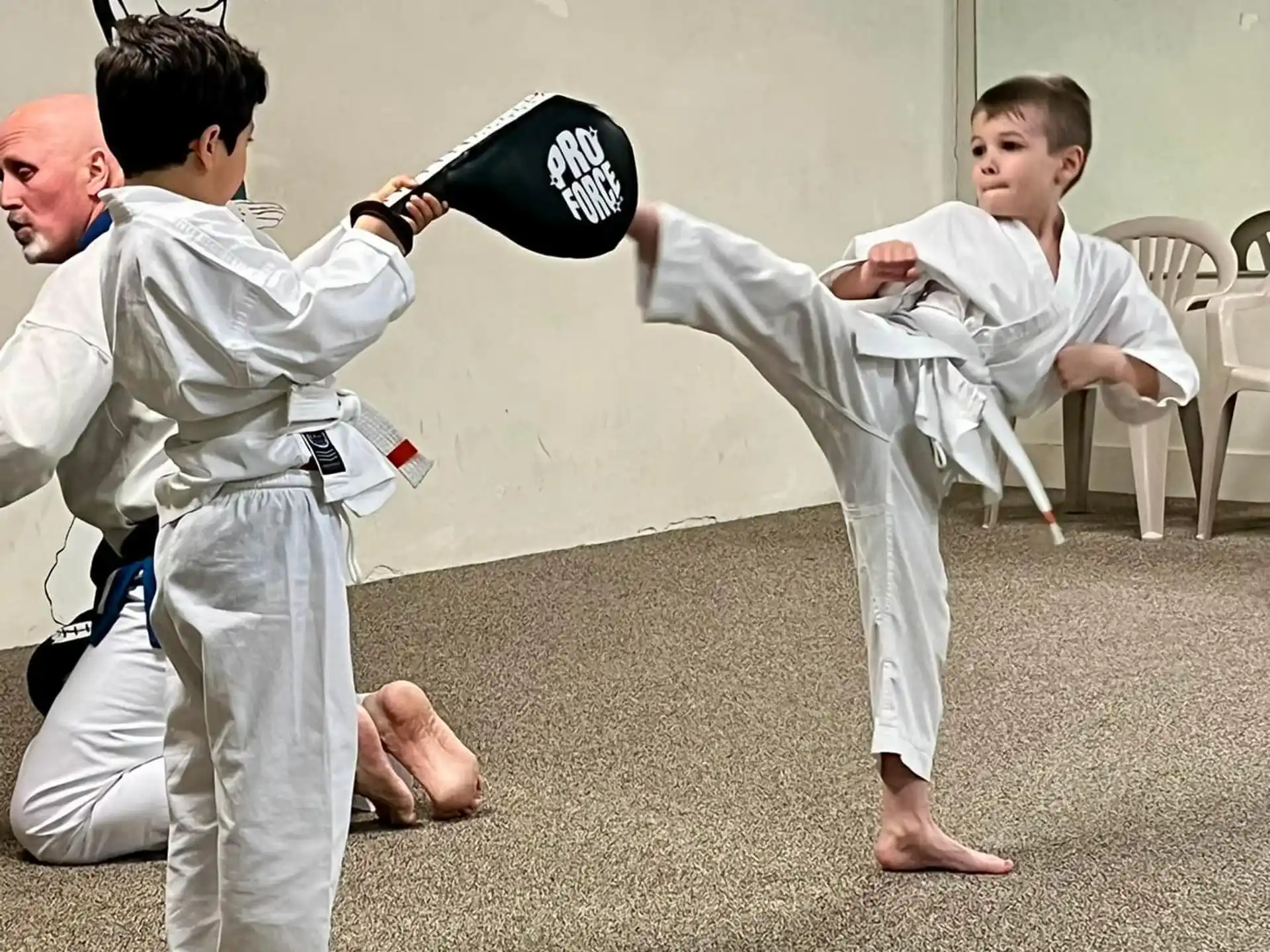 a group of men in karate uniforms