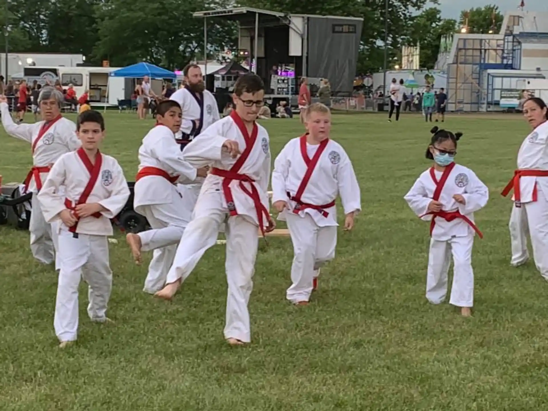 a group of people in karate uniforms
