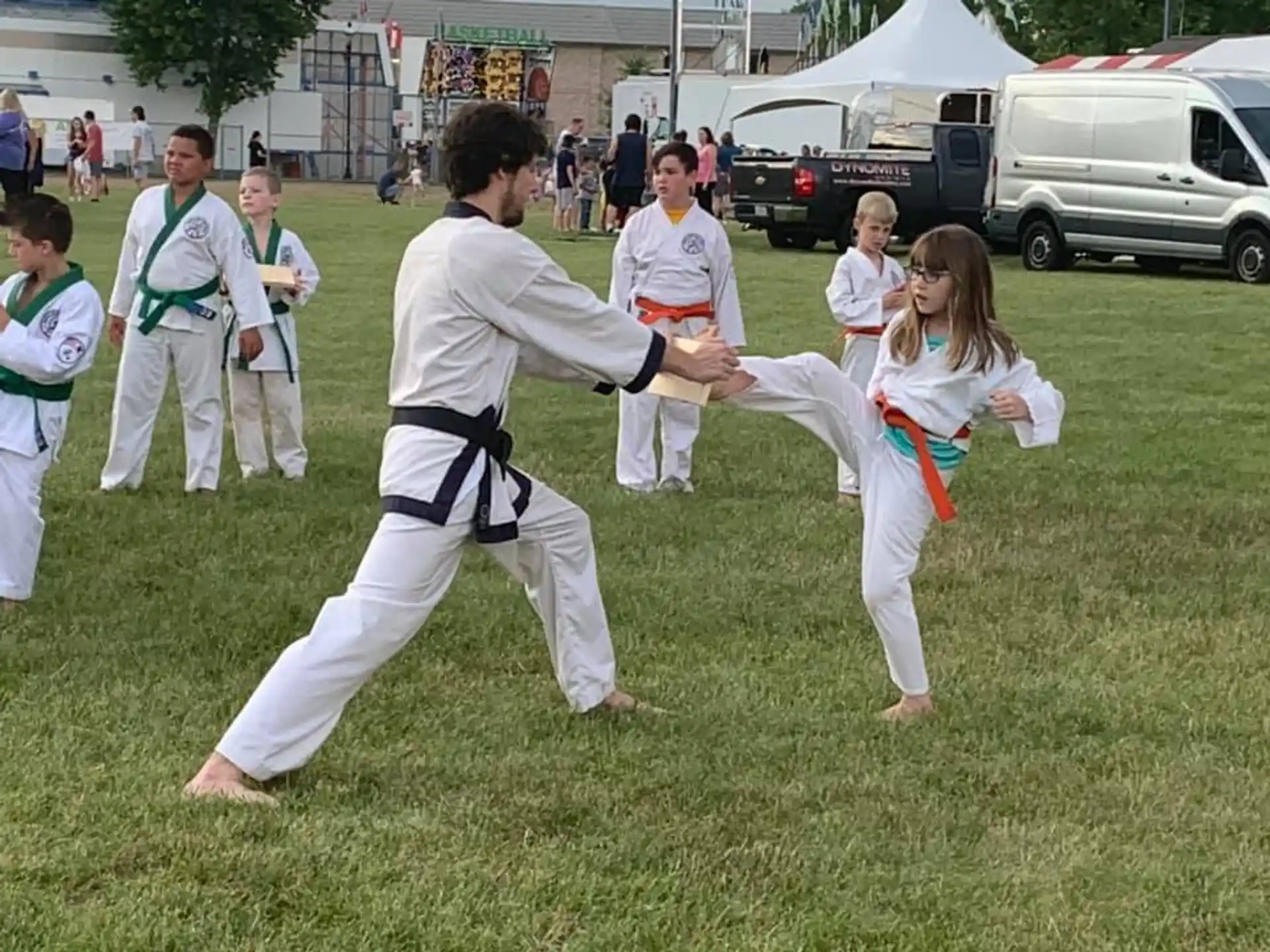 a group of people in karate uniforms