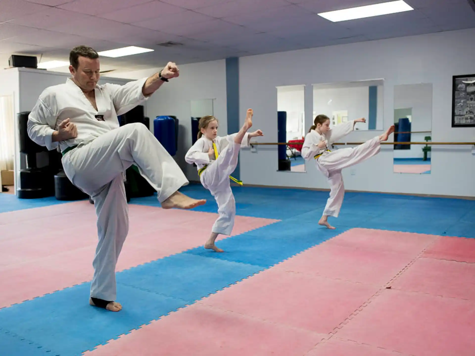 a group of people in karate uniforms