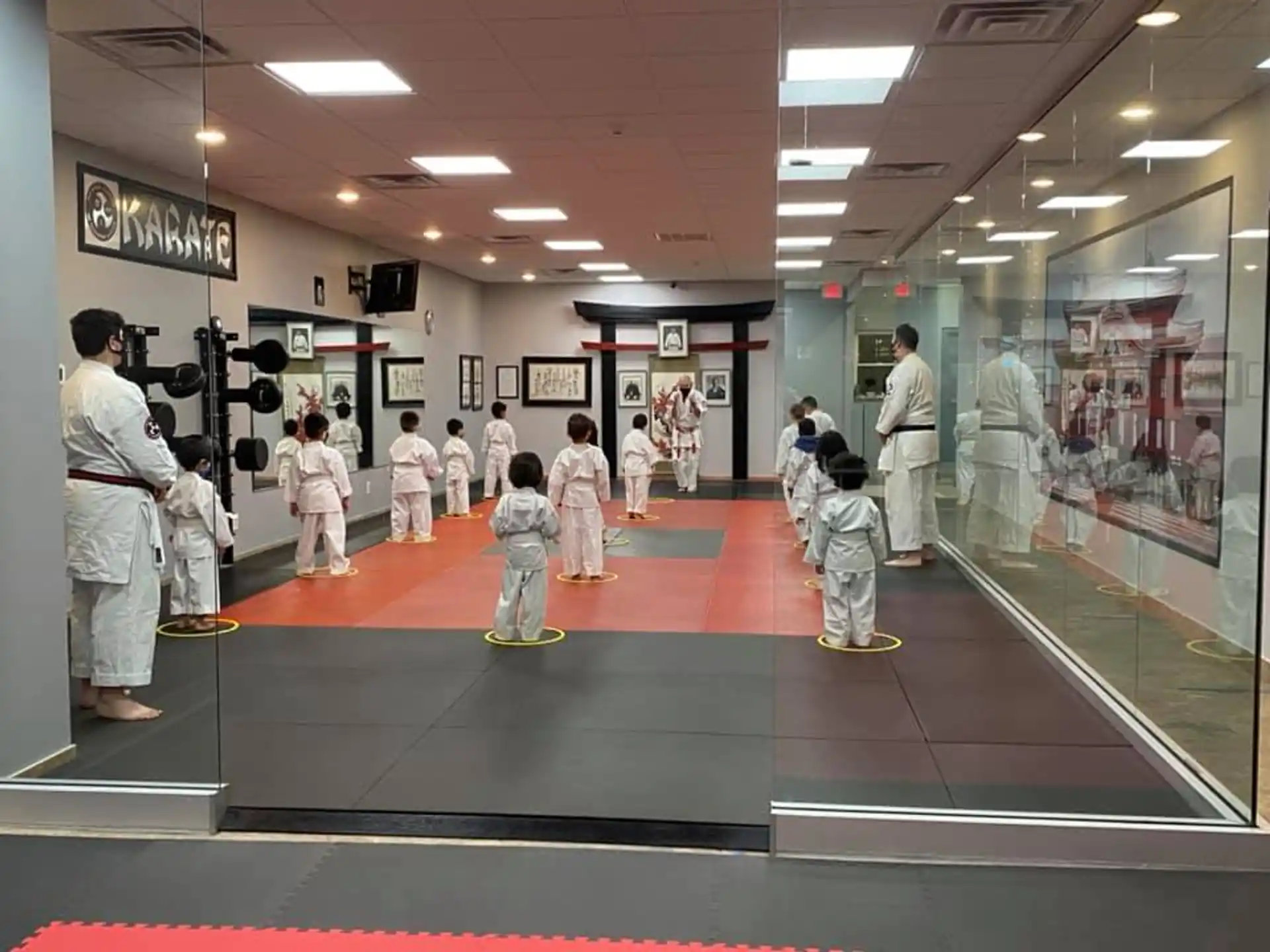 a group of people in white uniforms in a room