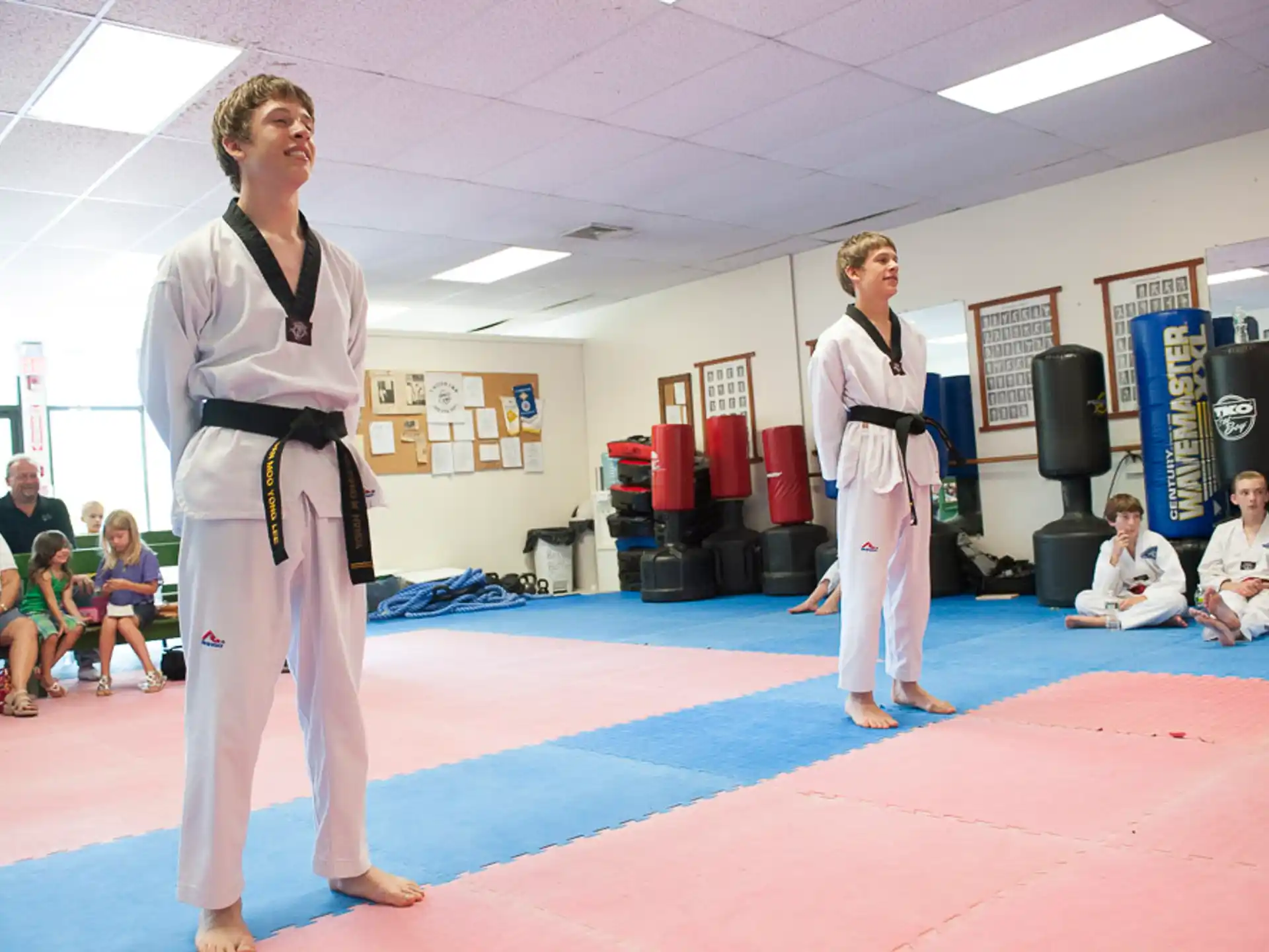 a couple of women in karate uniforms