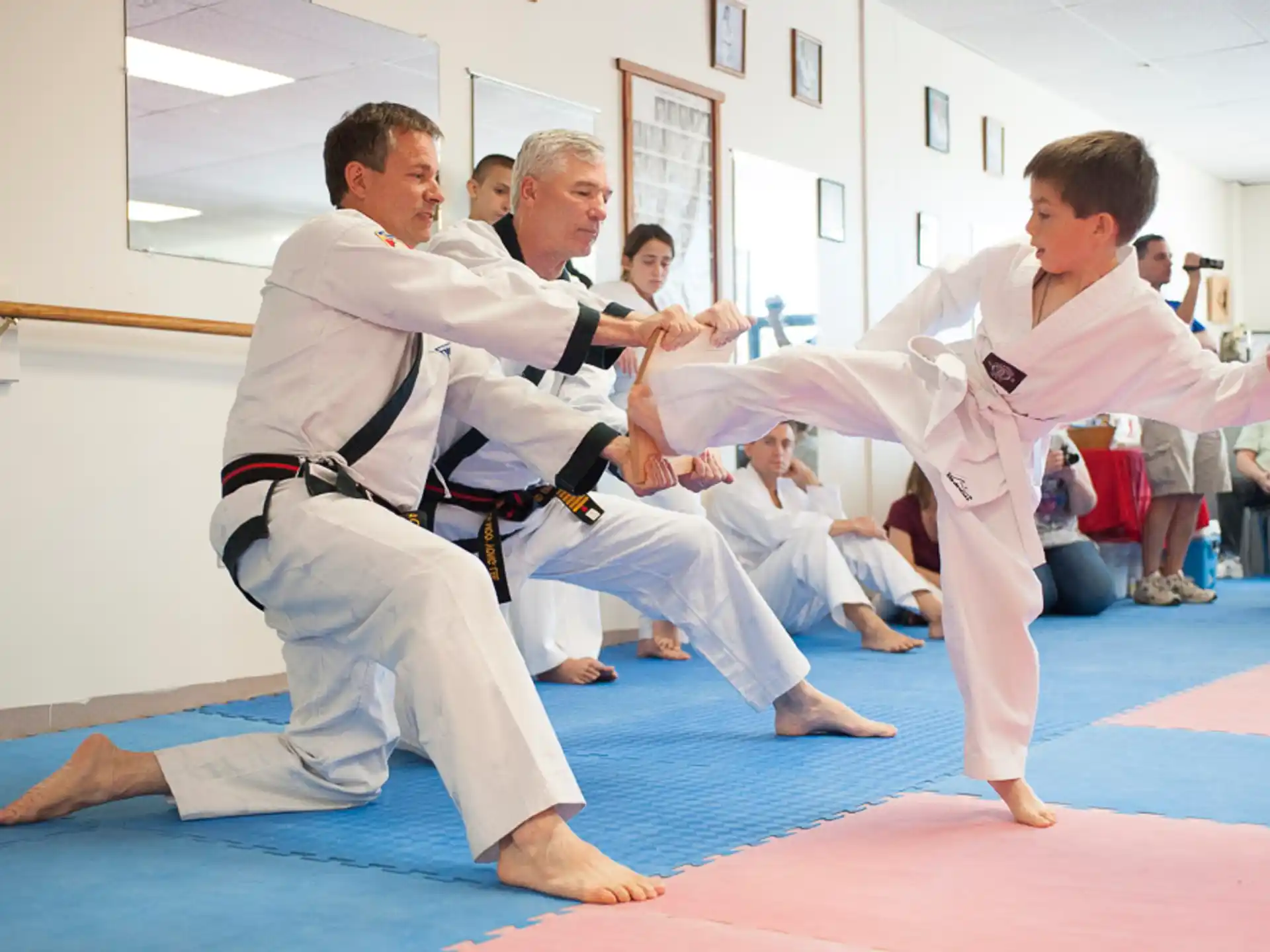 a group of men in karate uniforms