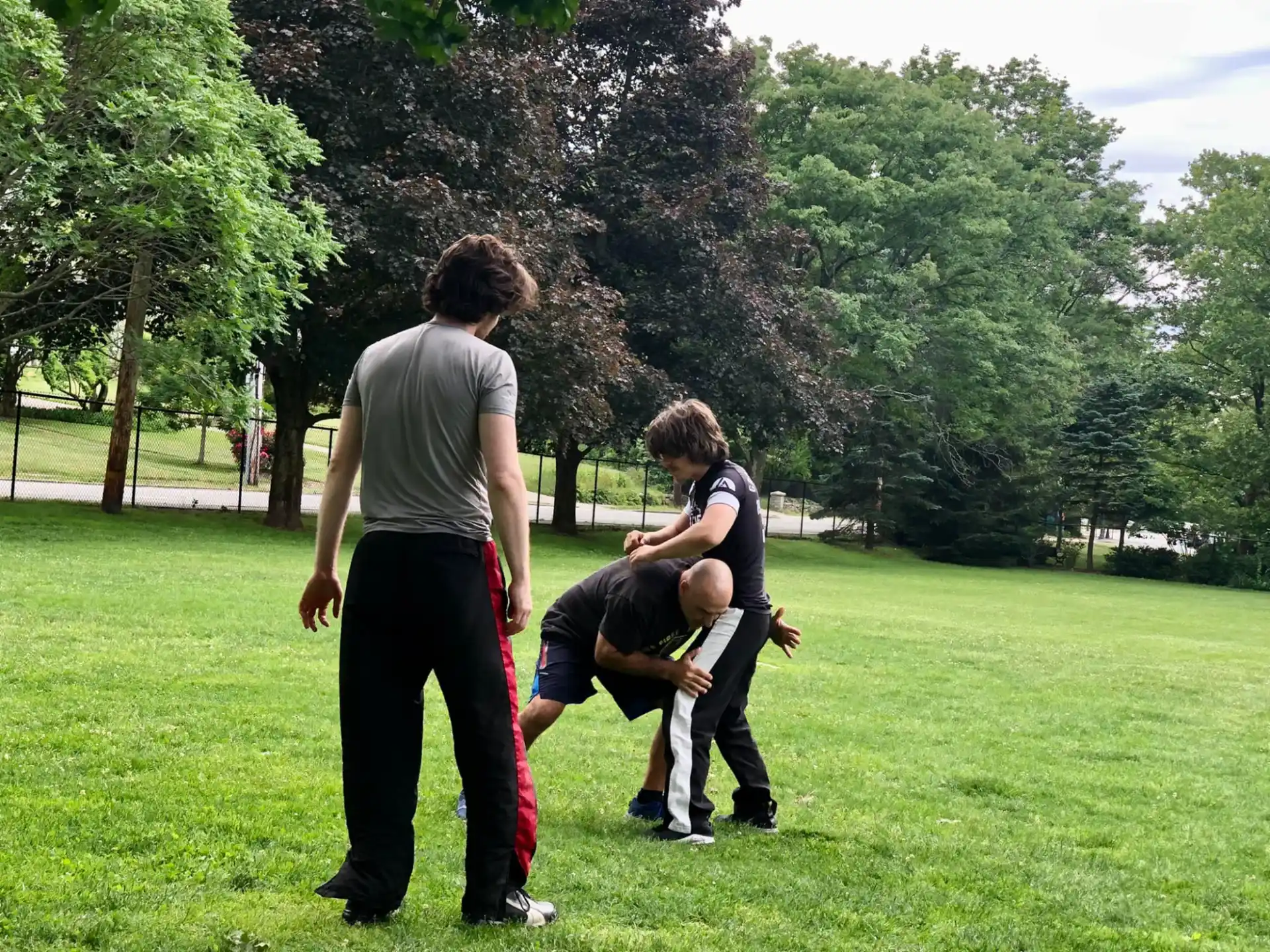 a group of people playing in a park