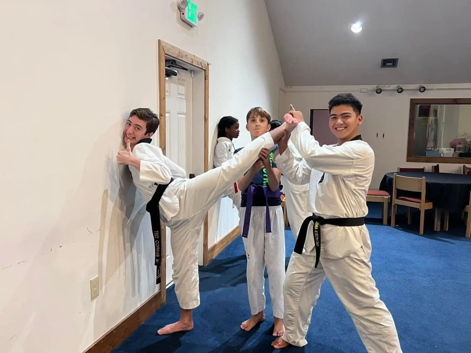 a group of people in karate uniforms