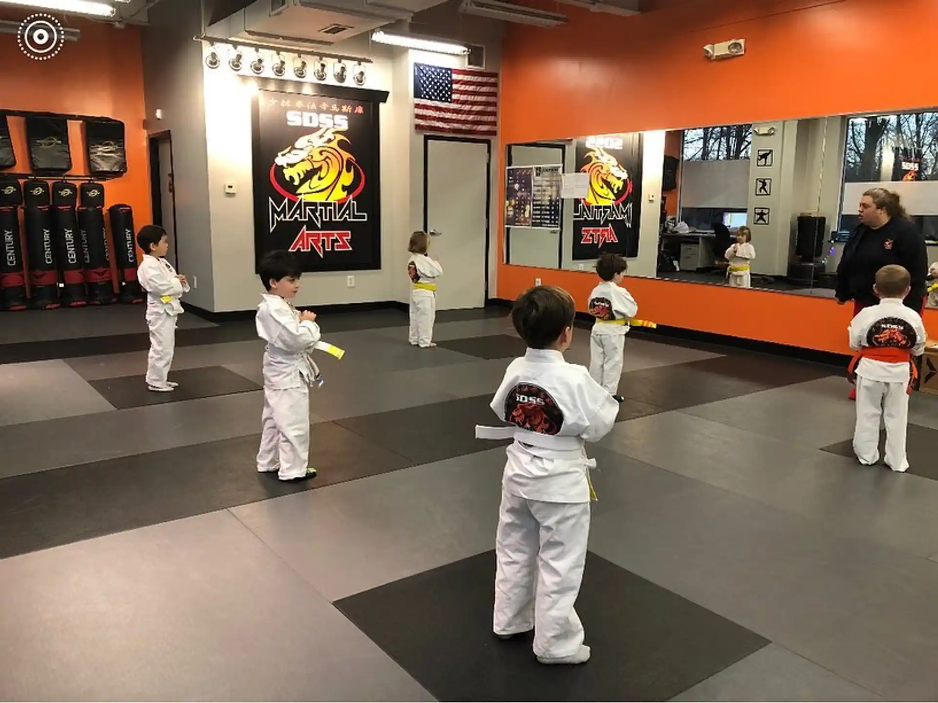 a group of kids in karate uniforms