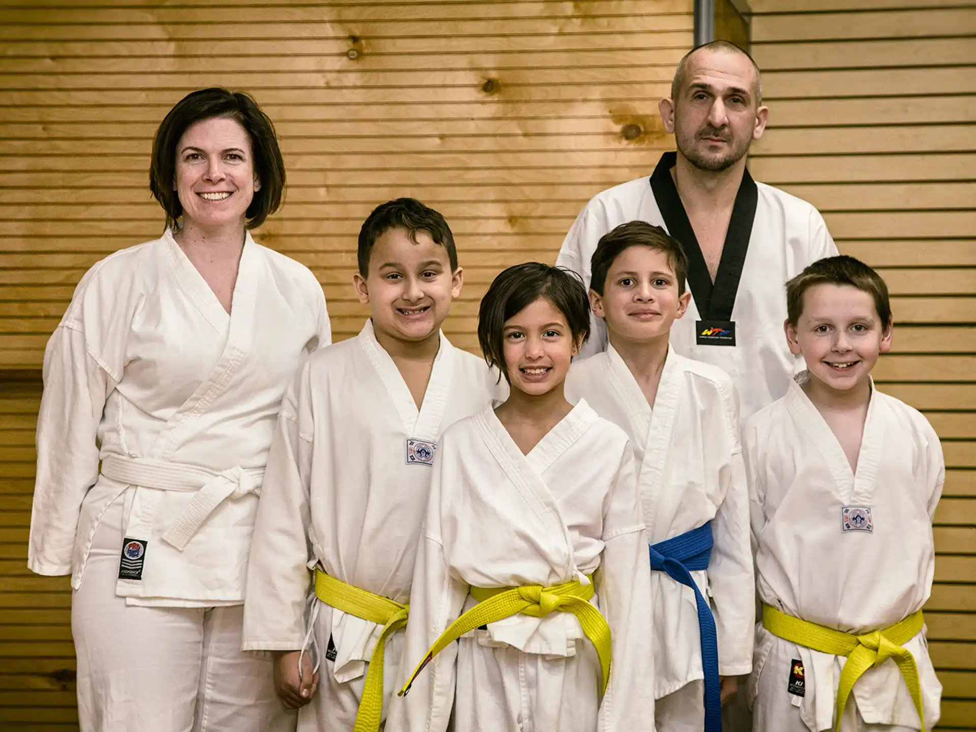 a group of people in karate uniforms