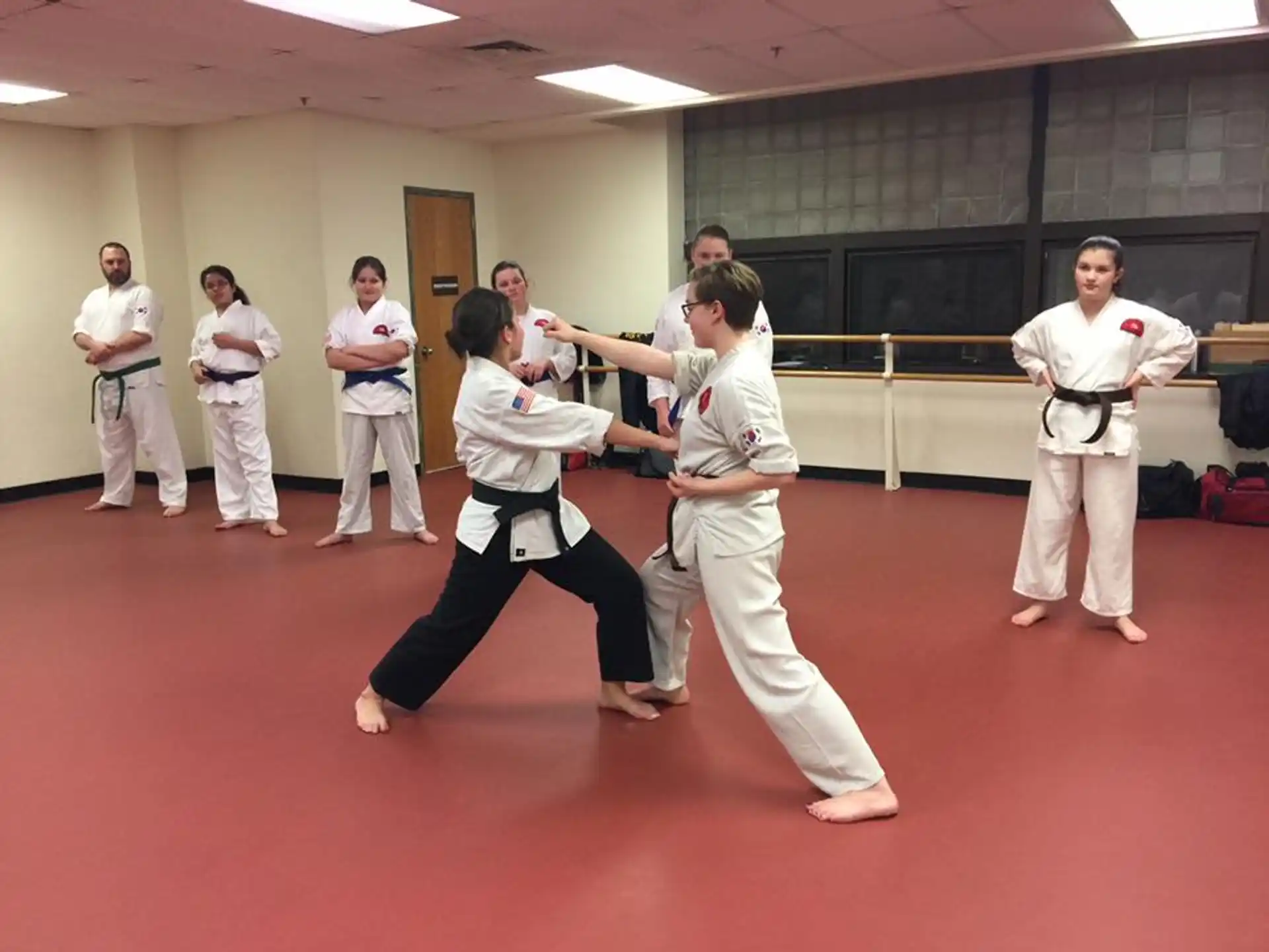 a group of people in karate uniforms