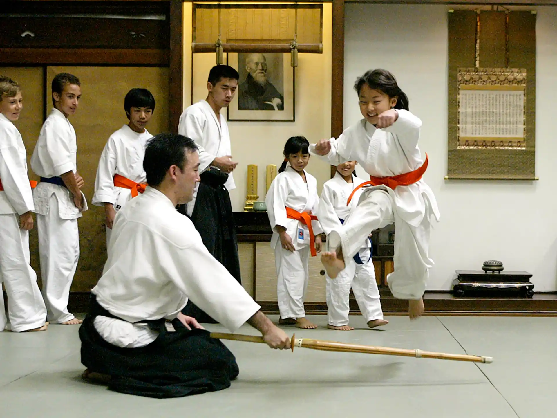a group of people in karate uniforms