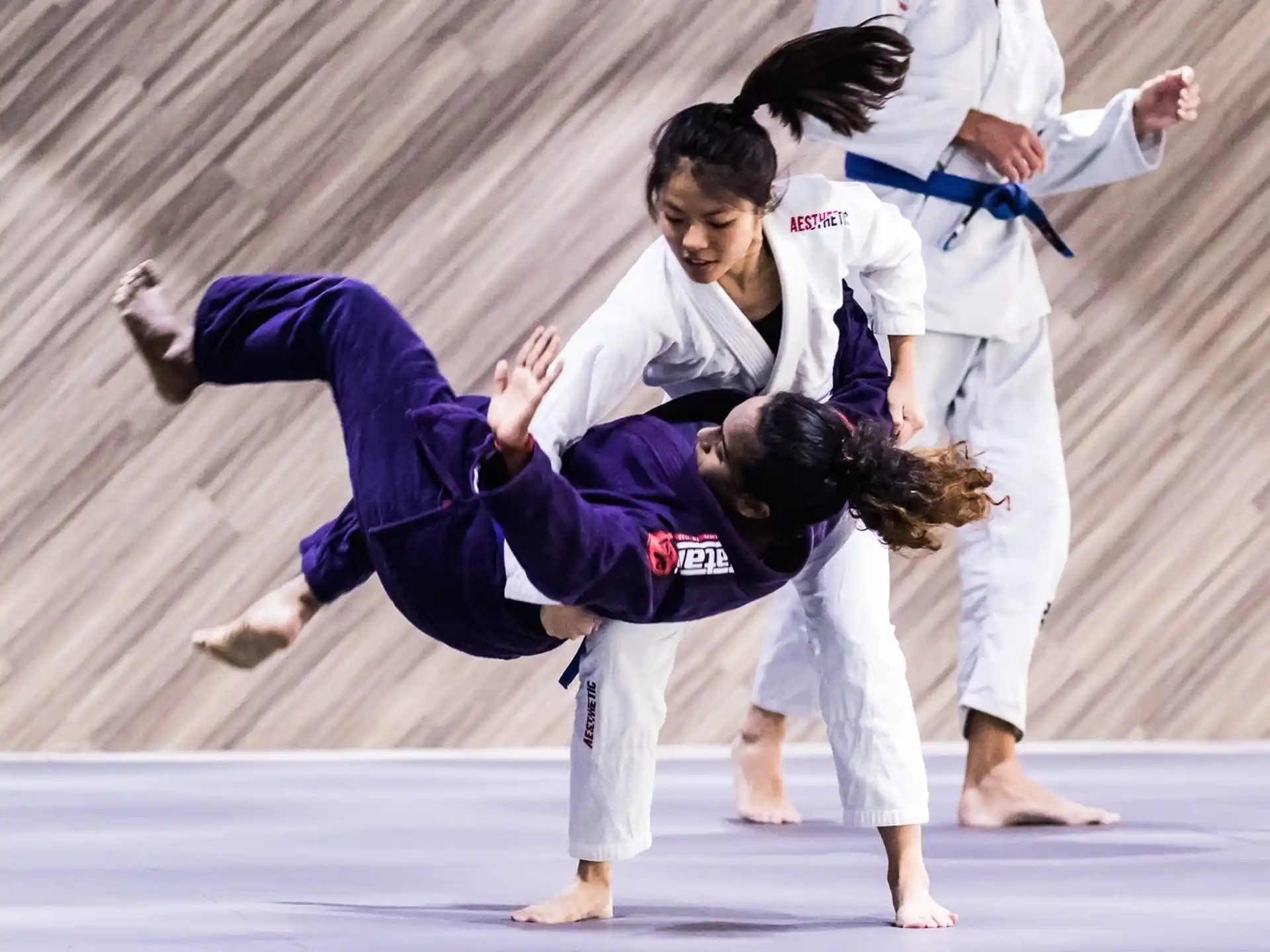 a group of people in karate uniforms
