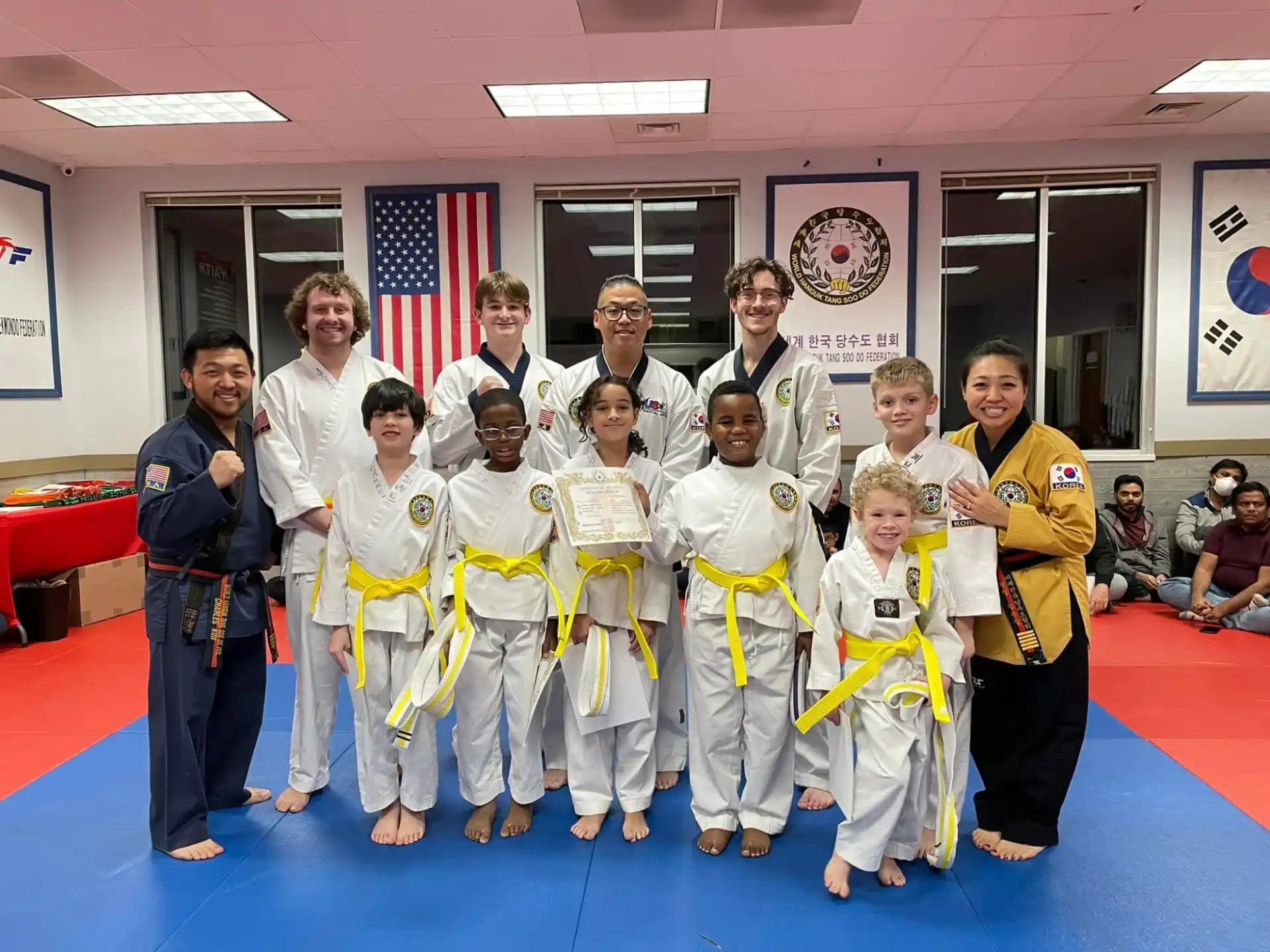 a group of people in karate uniforms