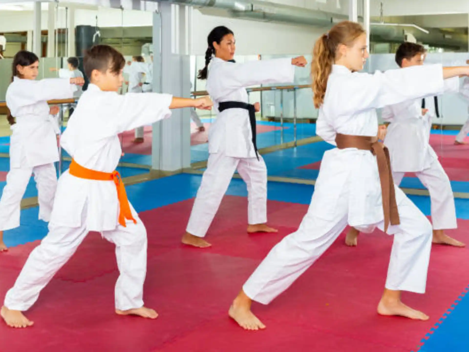 a group of people in karate uniforms