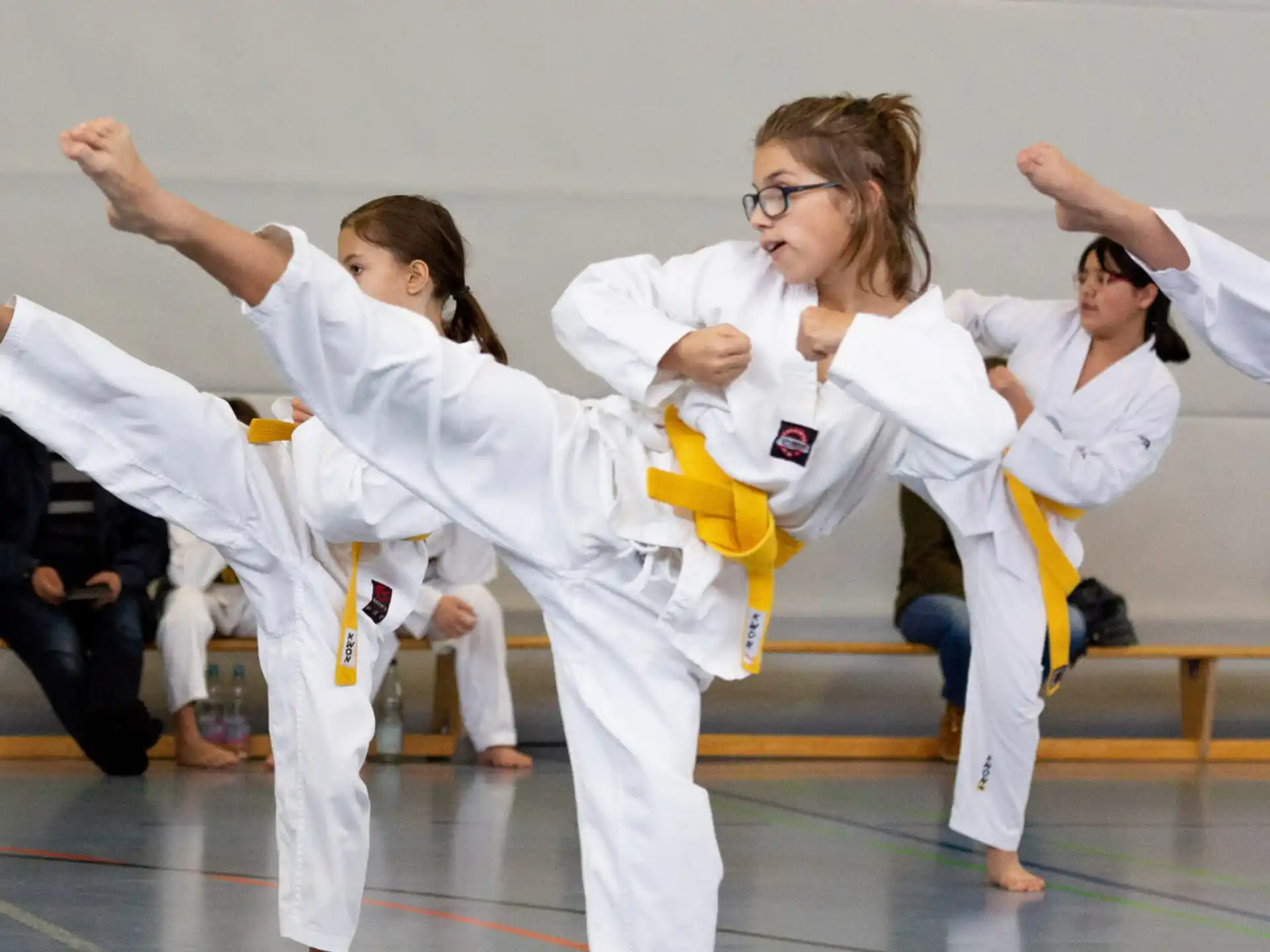 a group of people in karate uniforms