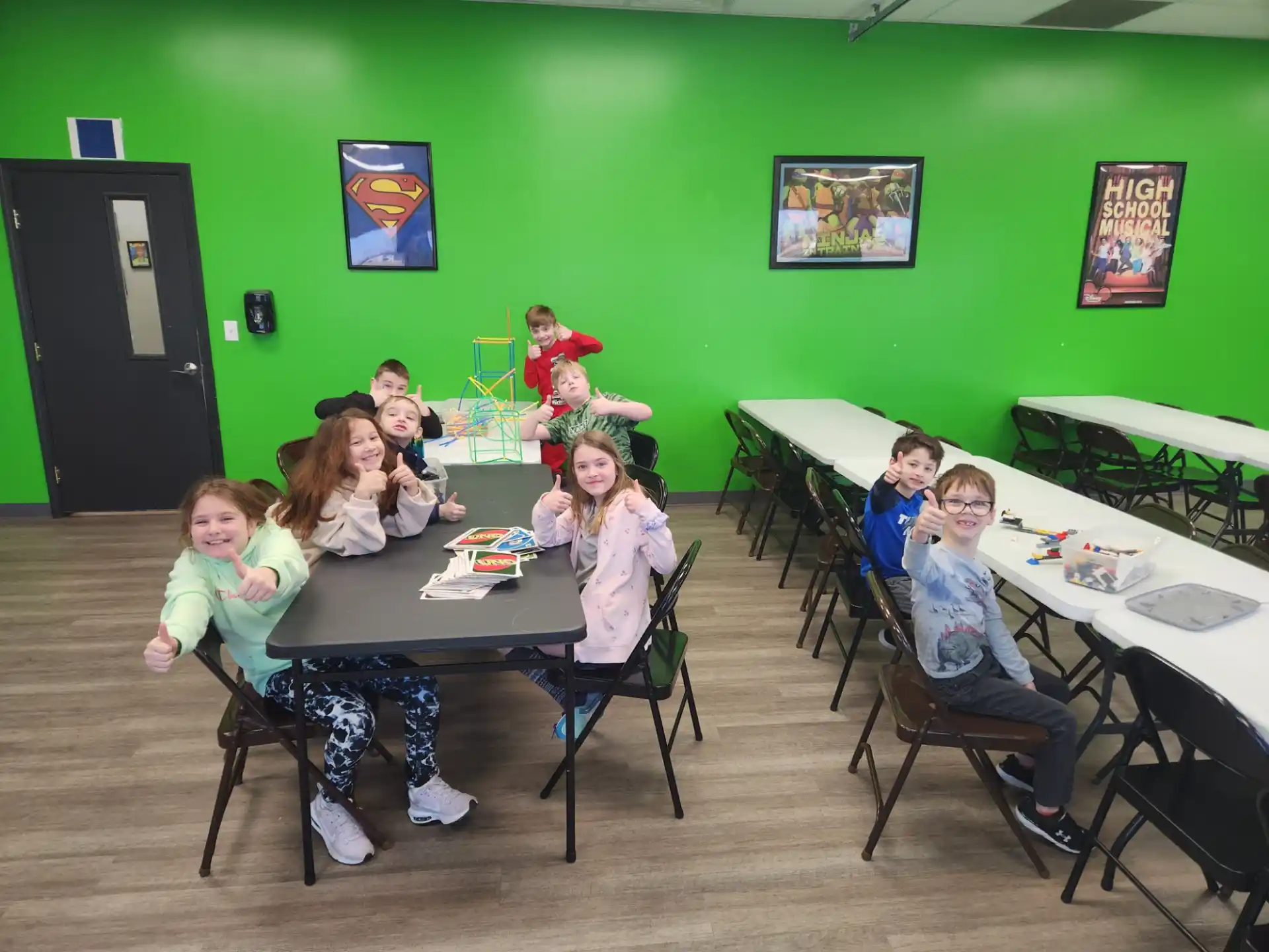 a group of children sitting at tables