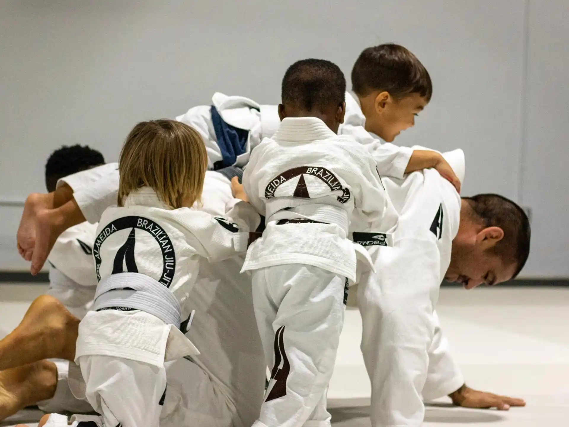 a group of boys in karate uniforms