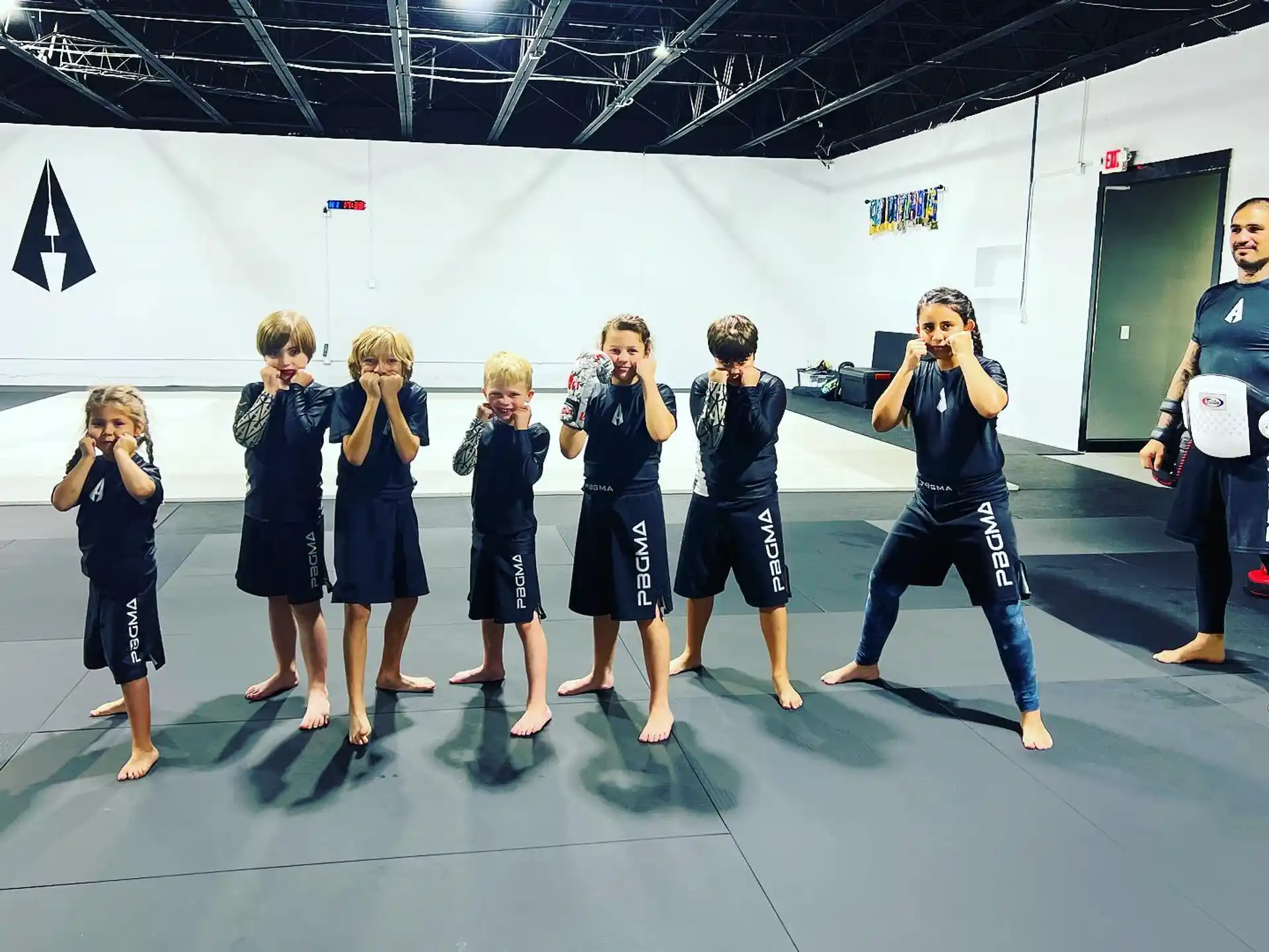 a group of children in blue uniforms