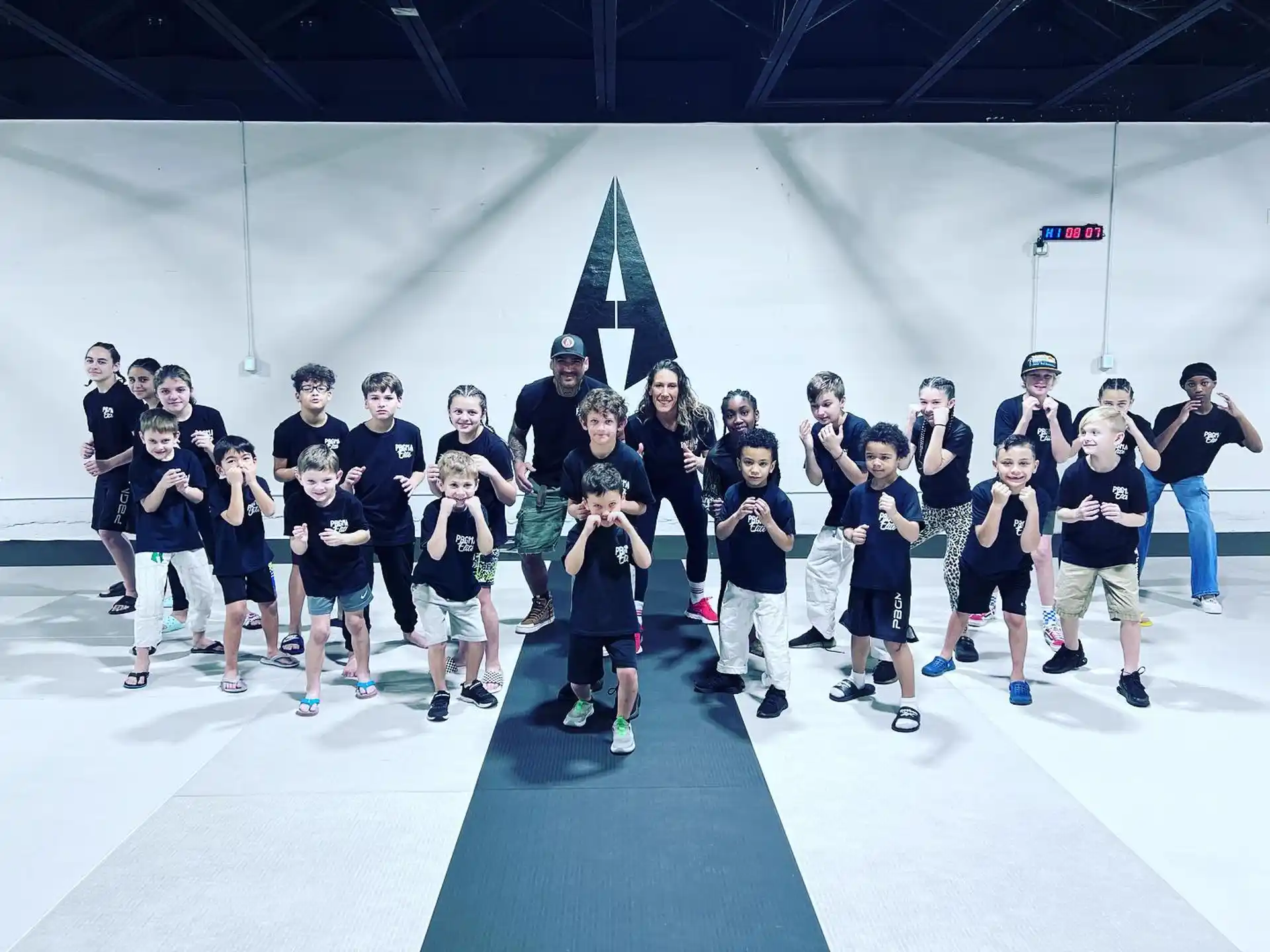 a group of people wearing ice skates posing for the camera