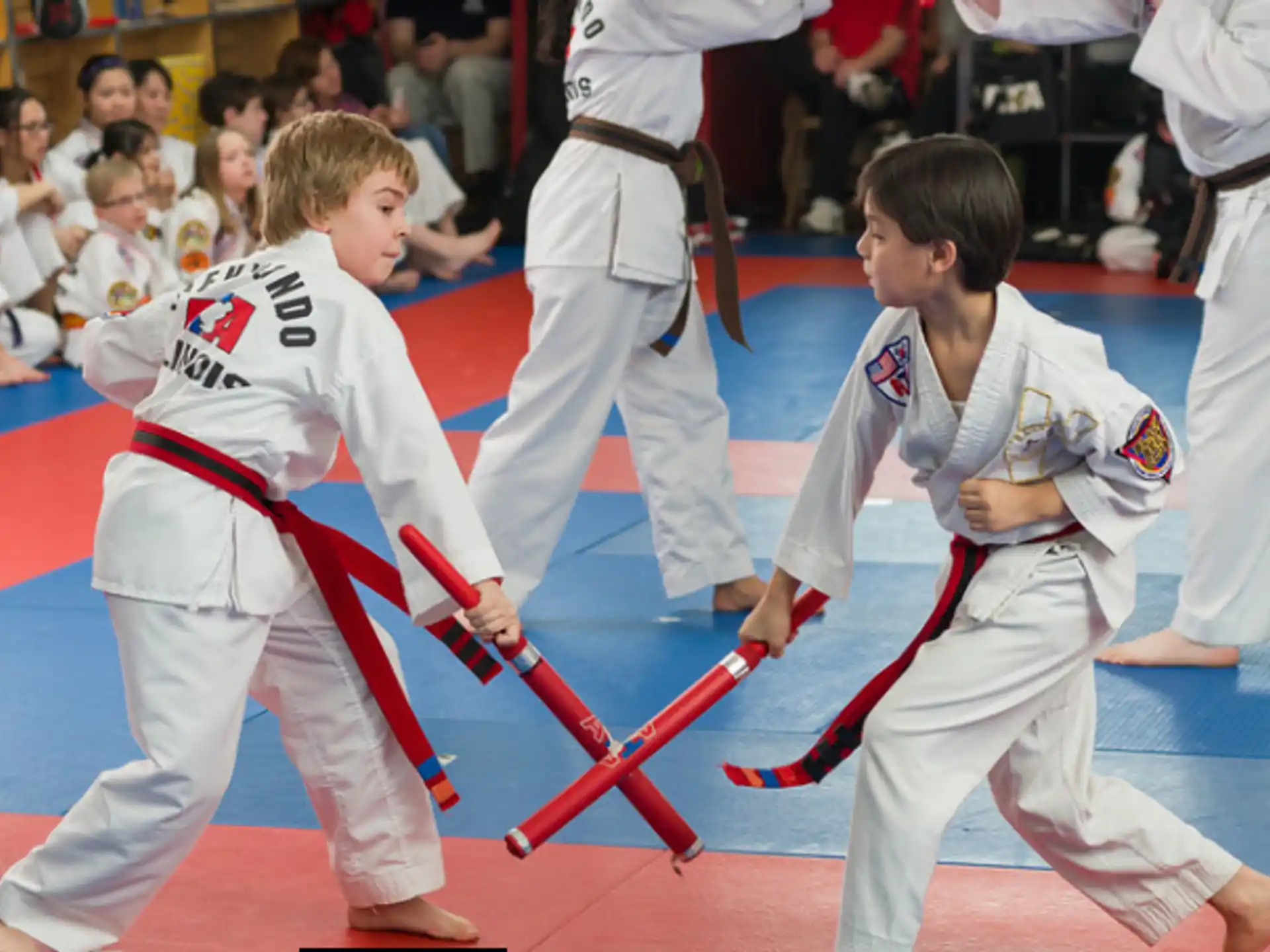 a group of people in karate uniforms