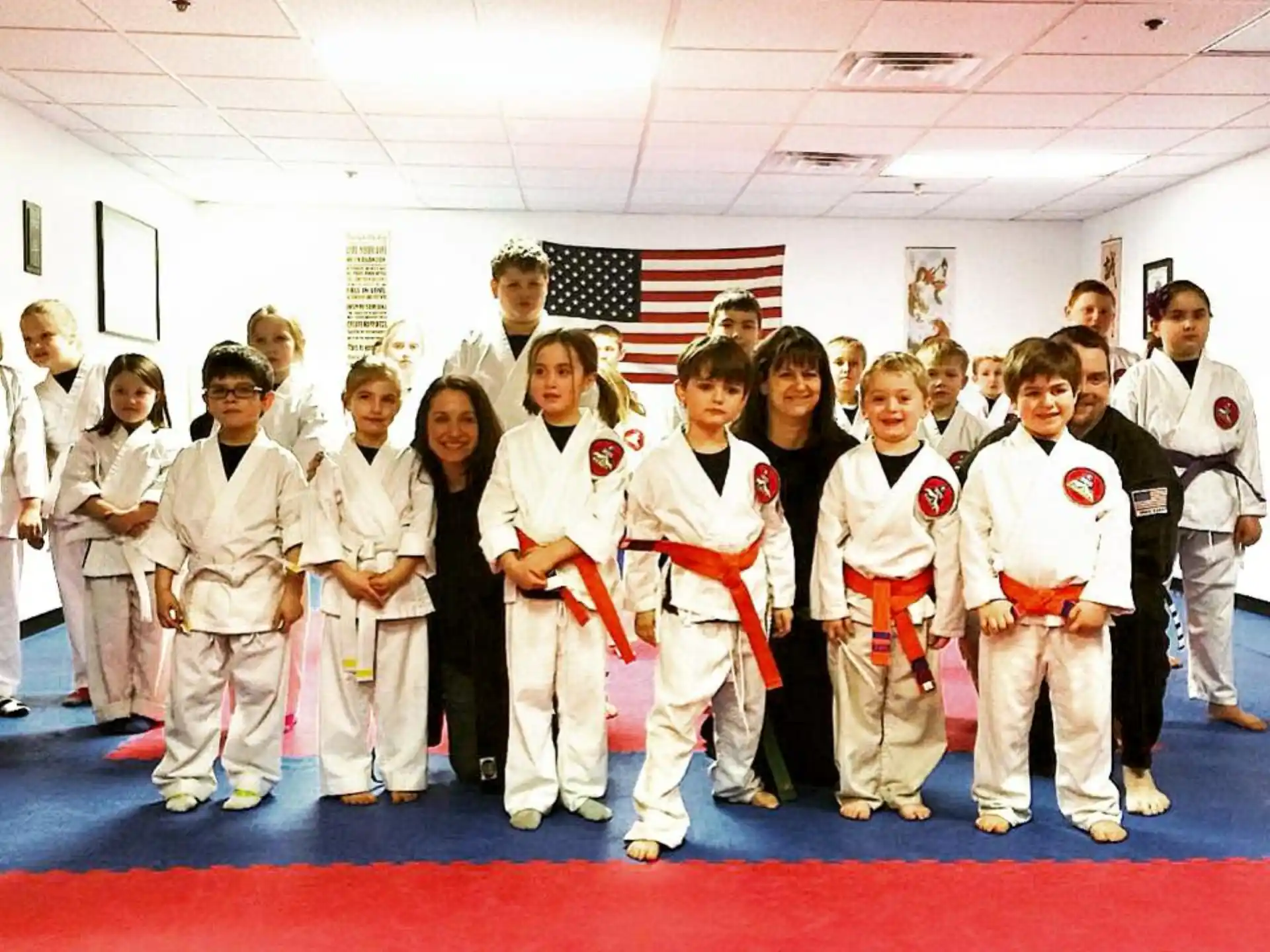 a group of people in karate uniforms