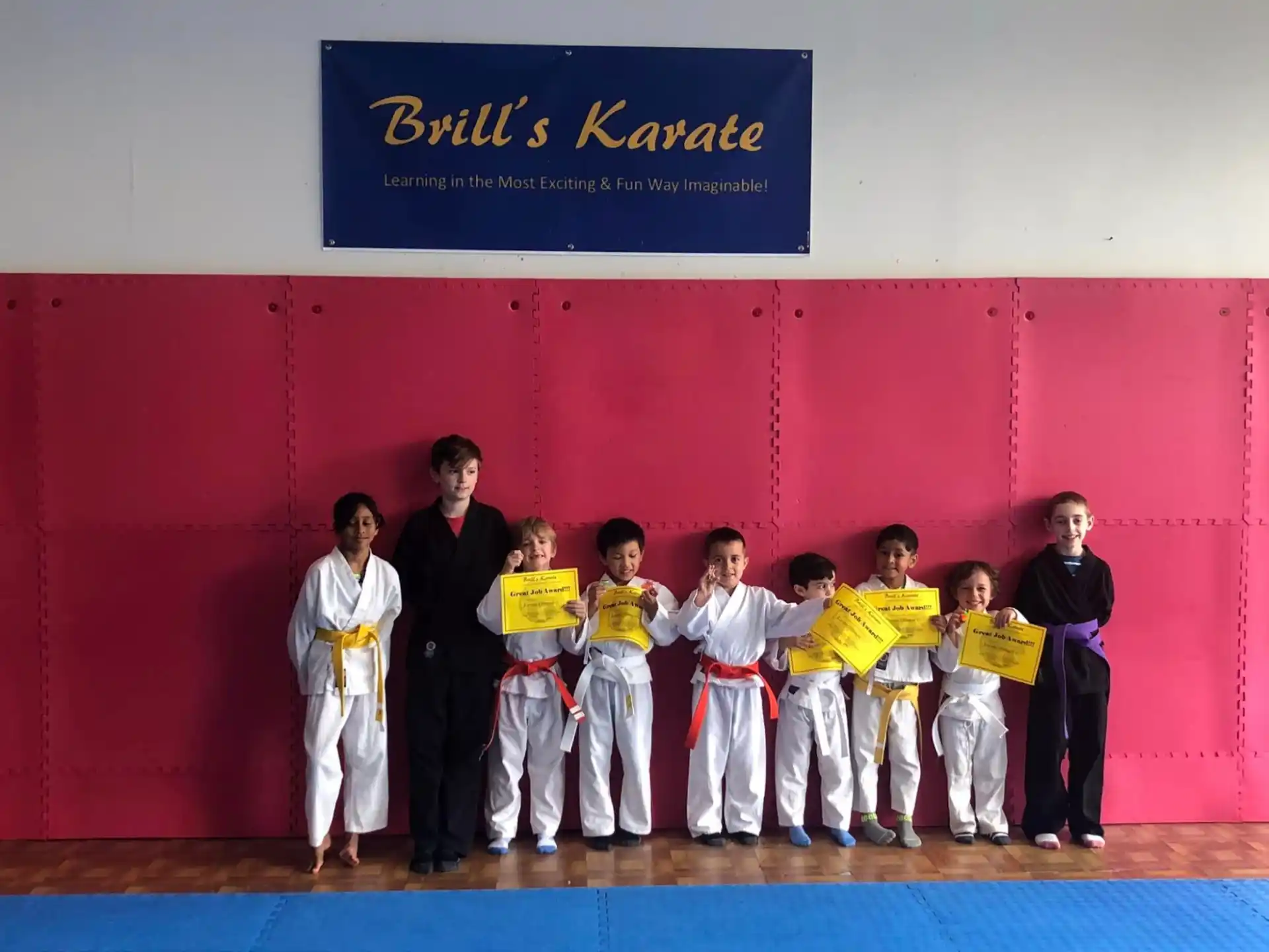 a group of people in karate uniforms