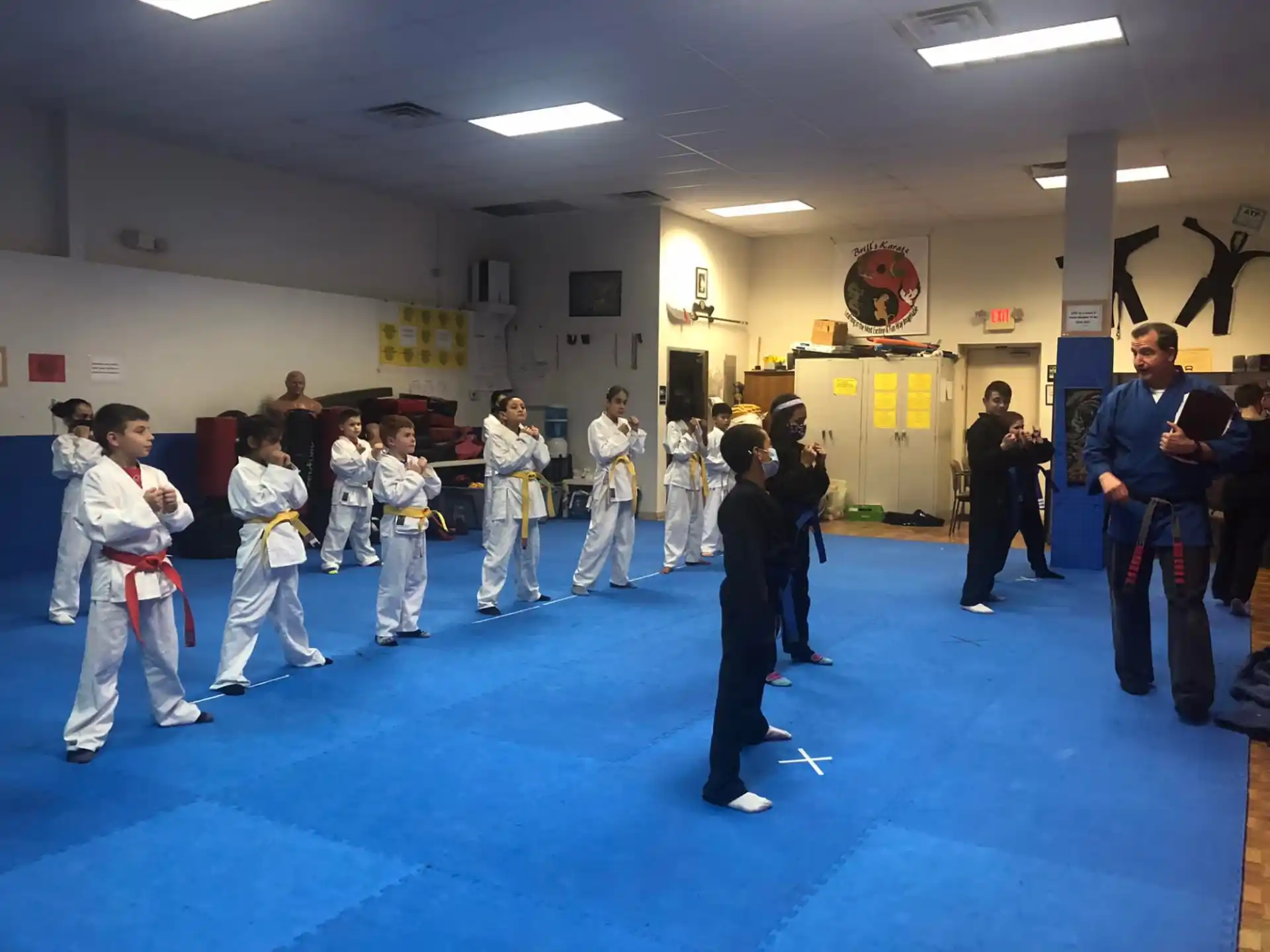a group of people in karate uniforms