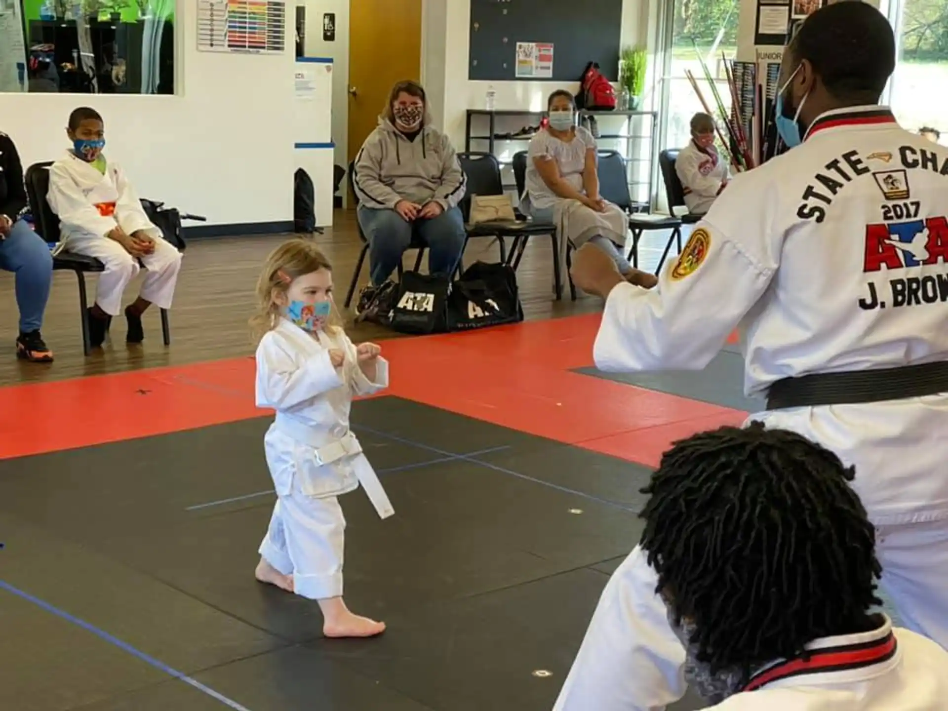 a child in a white outfit