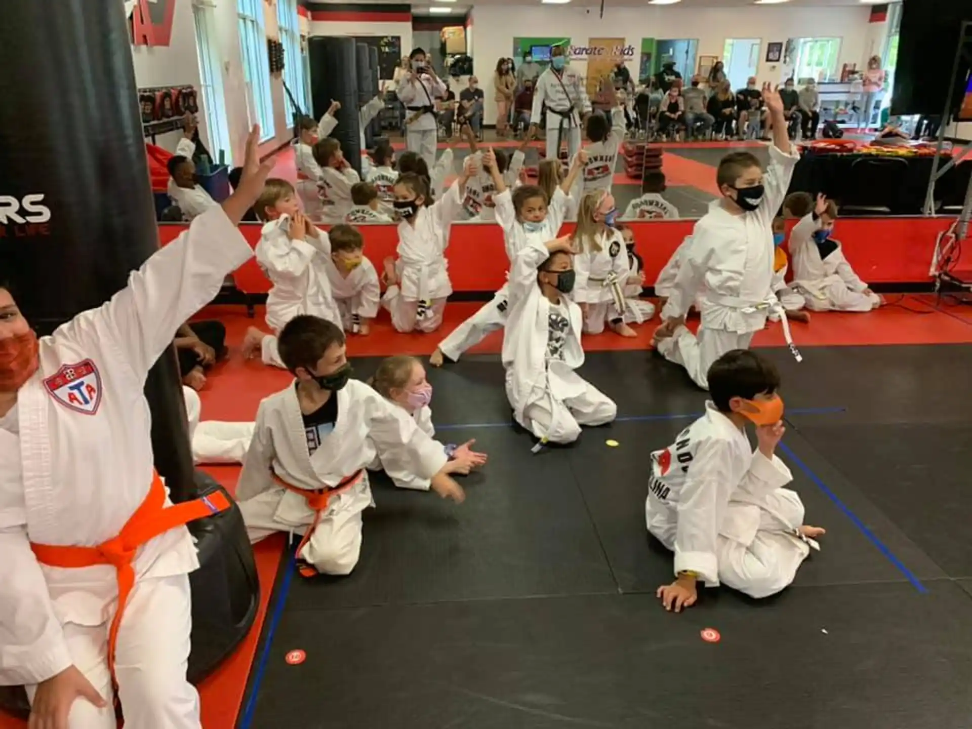 a group of people in karate uniforms